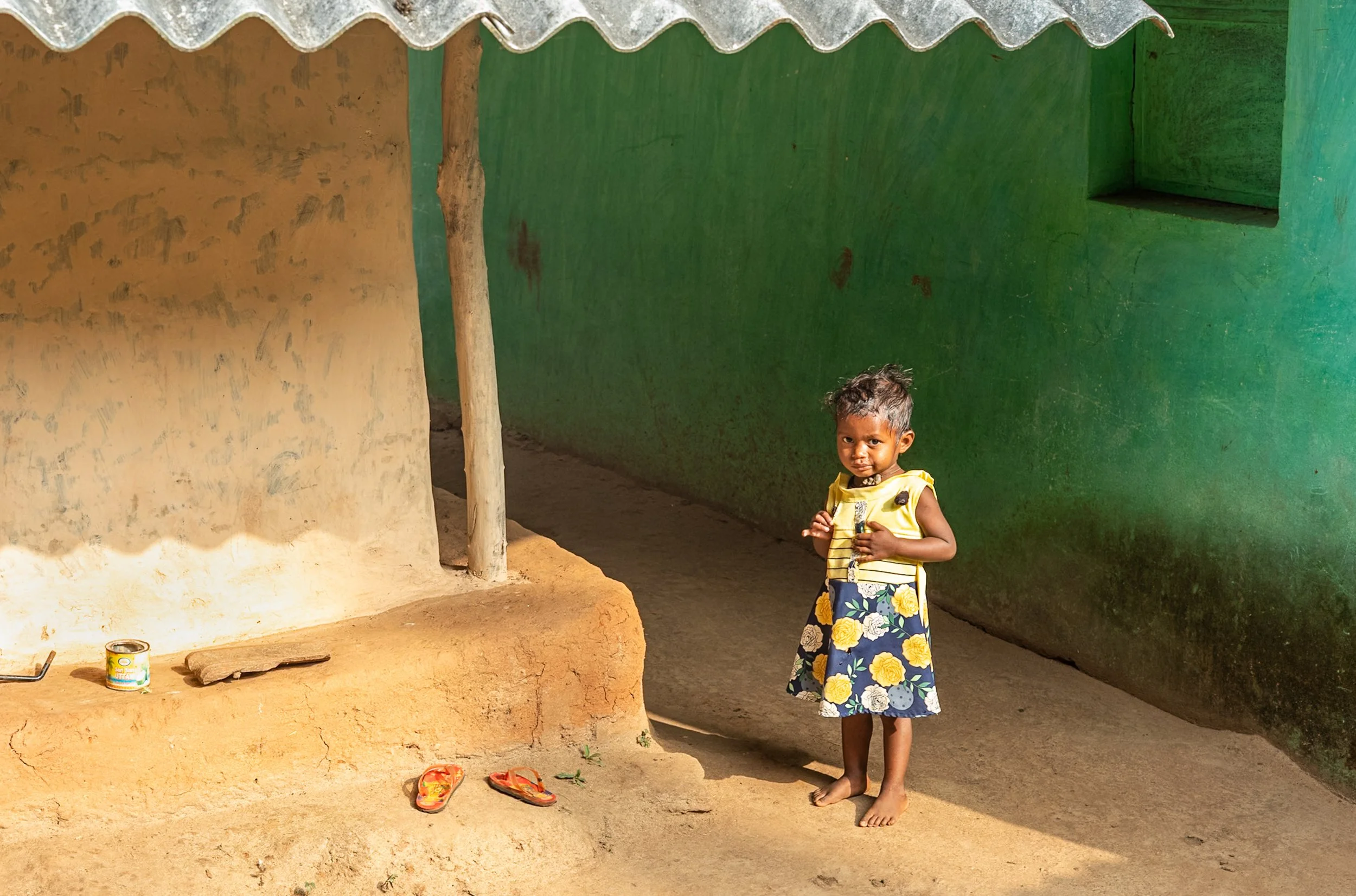 Small girl on green background in Odisha