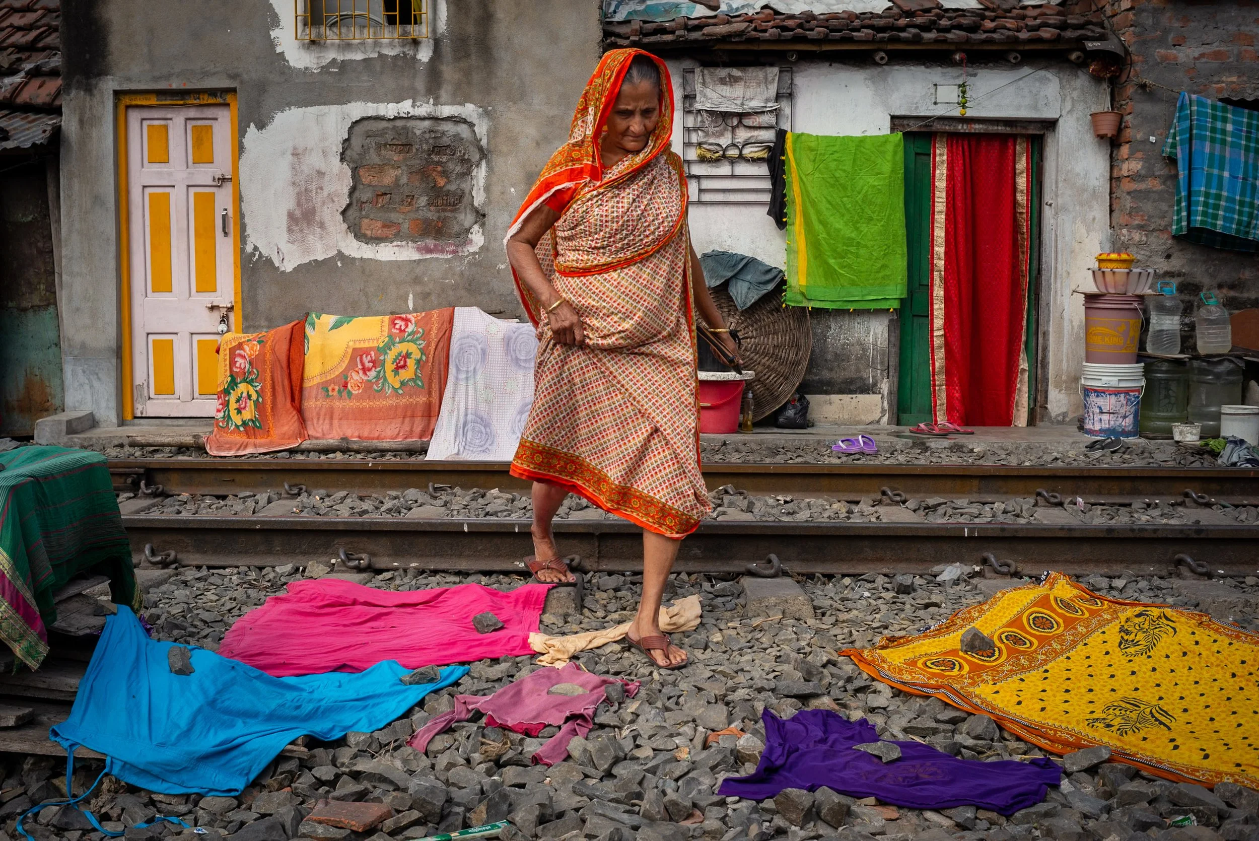 Woman crossing railway in Kolkata railway community