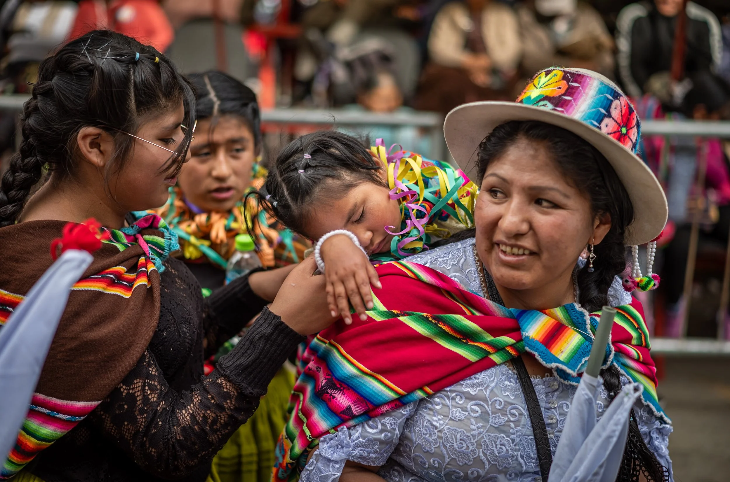 Child in aguaio sleeping during Andean Anata