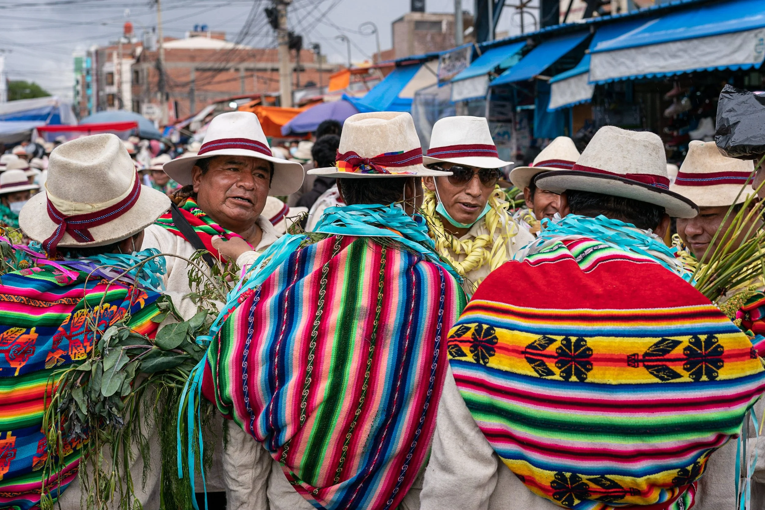 Men with aguaios during Andean Anata