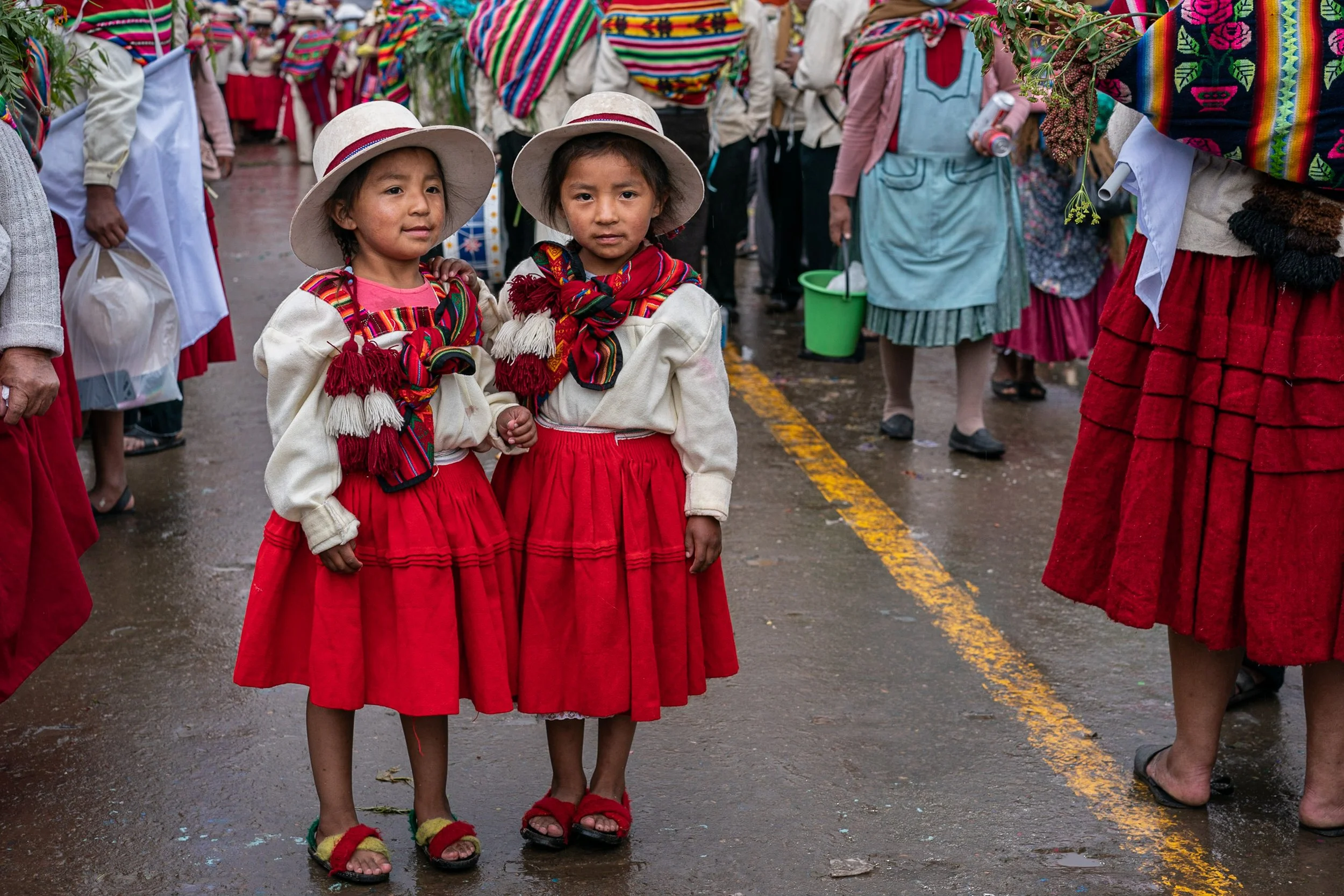 Twins in red skirt during Andean Anata