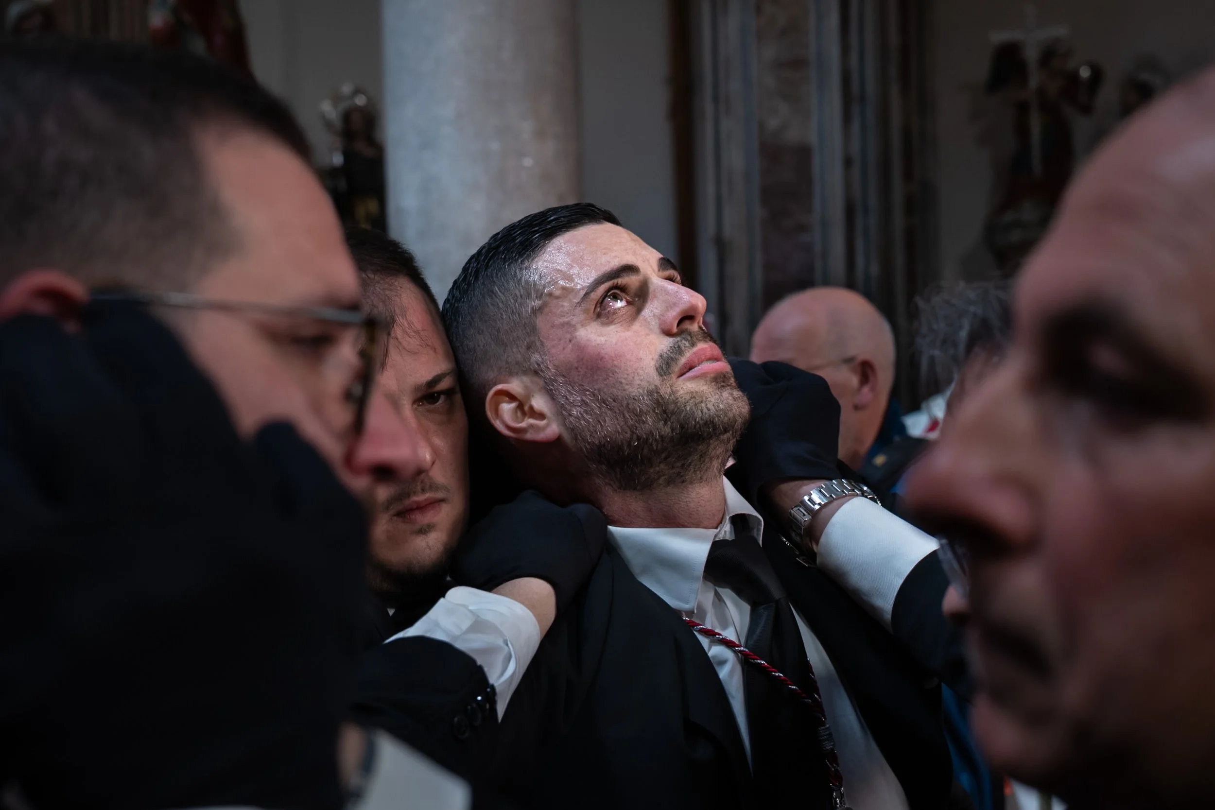 Devotee looking up at end of Easter procession in Trapani 