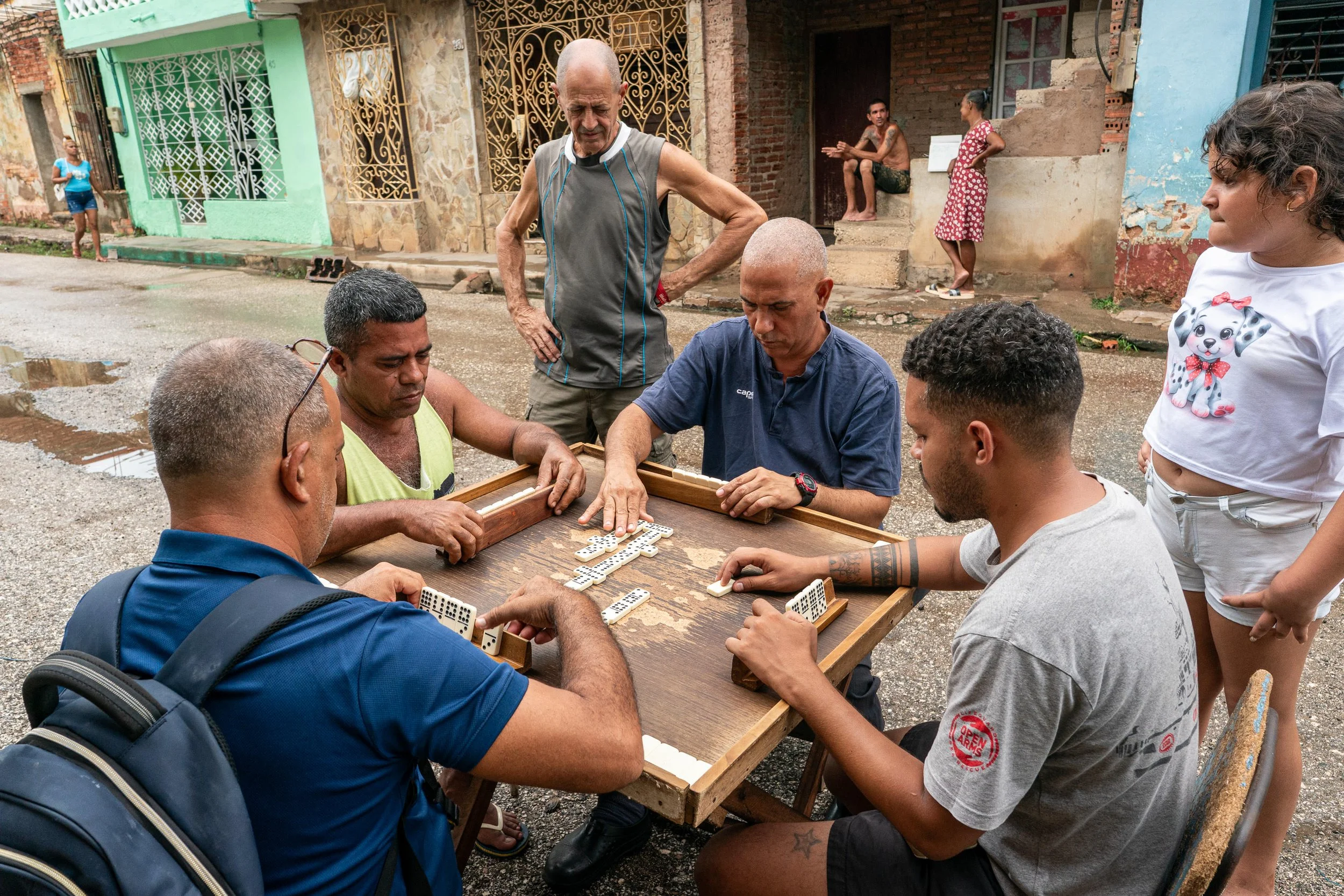 Group playing dominoes in the street in Trinidad, Cuba