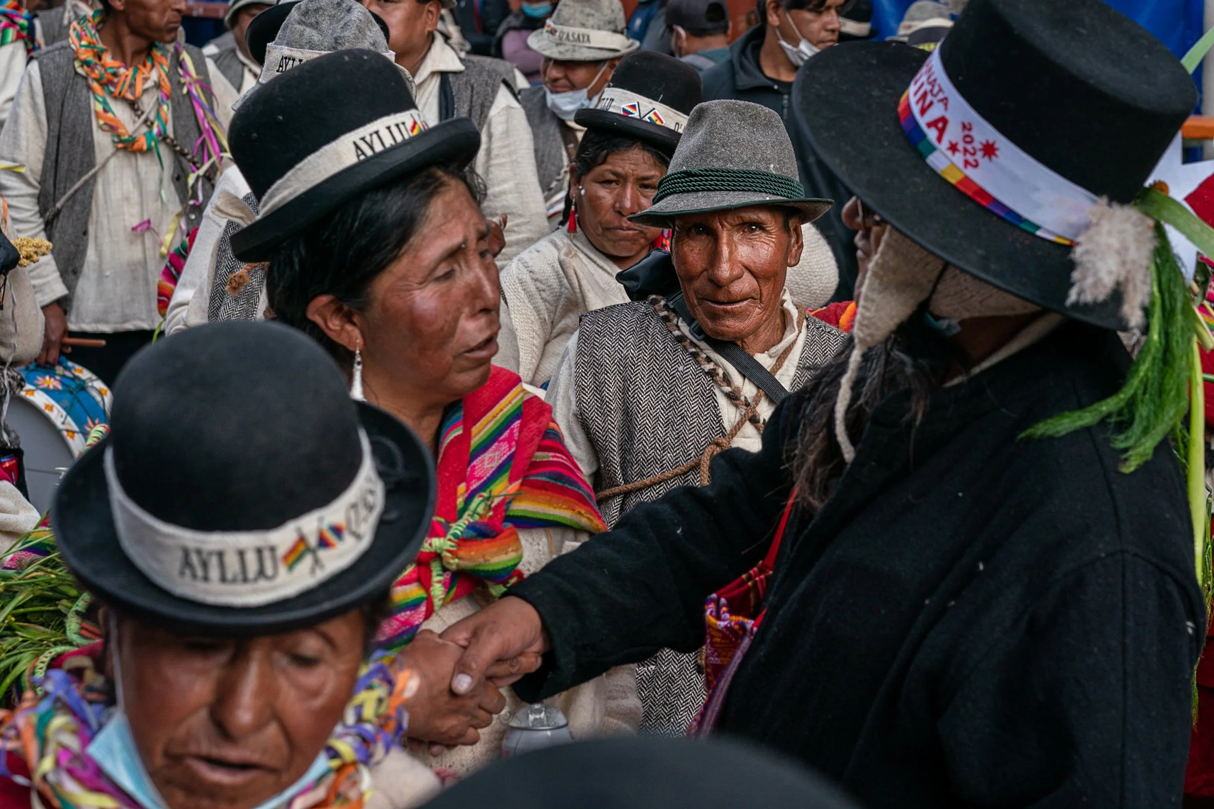 Group during parade with man with piercing eyes looking at camera