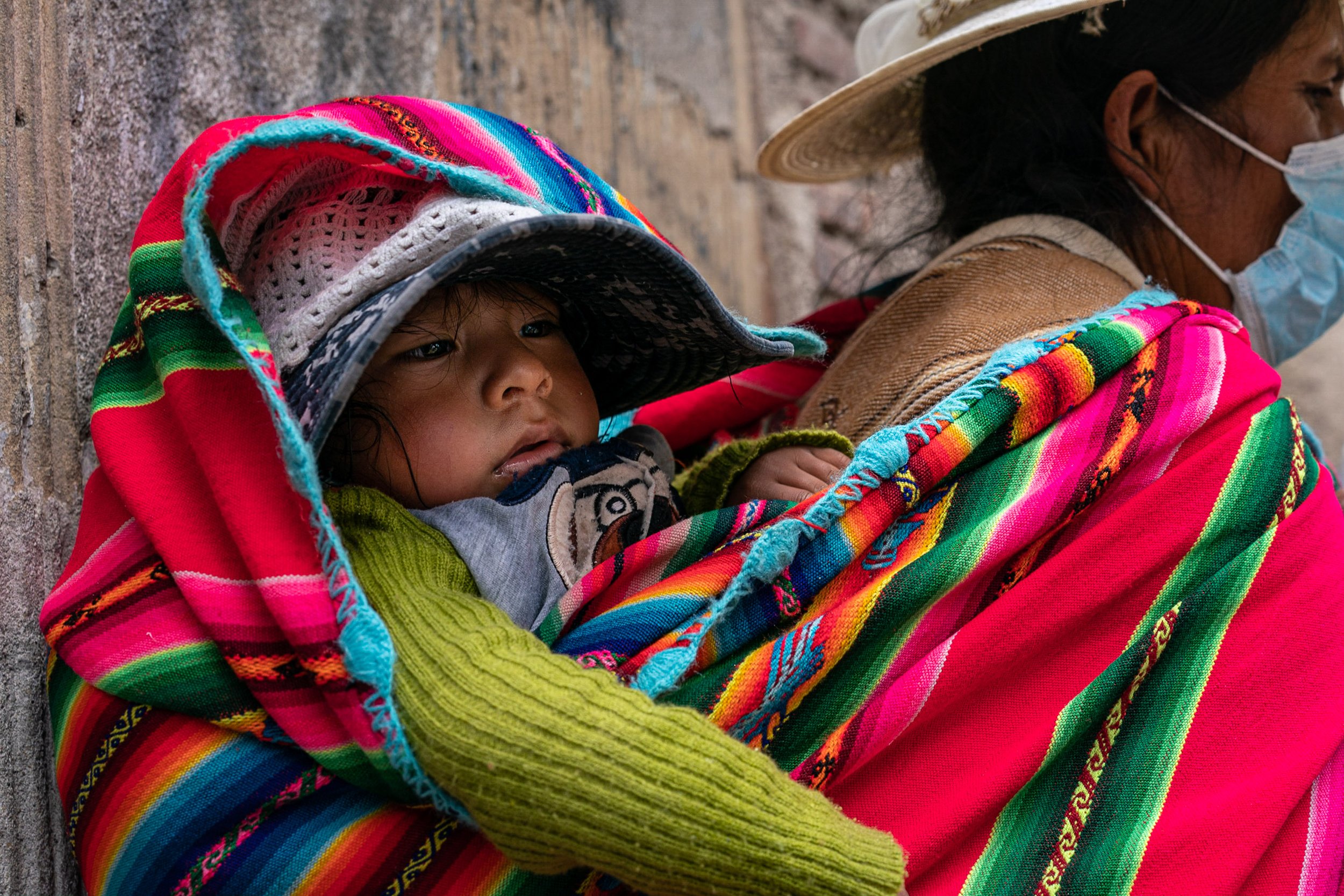 Child in aguaio during Andean Anata