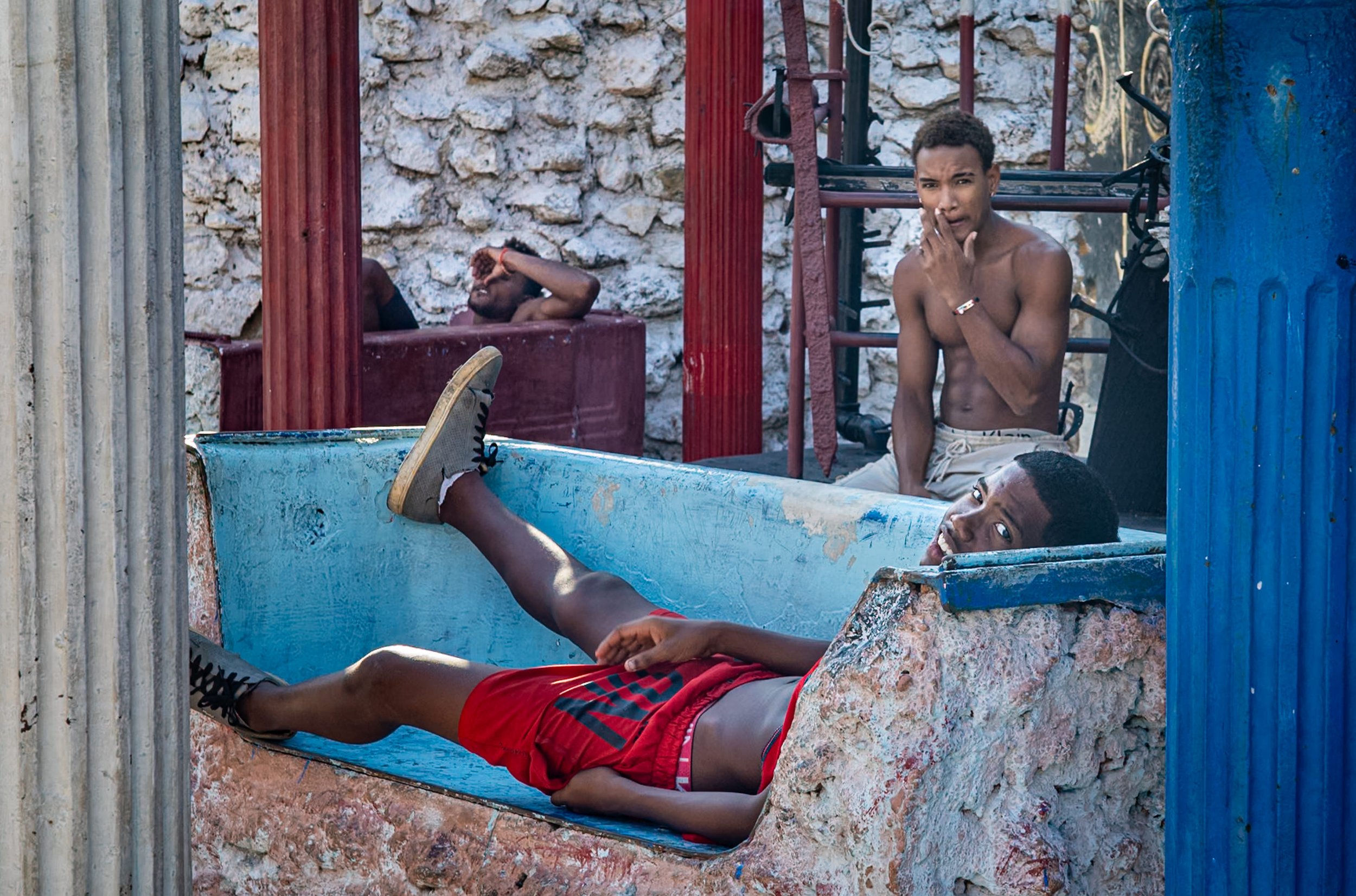 Three cuban boys lounging
