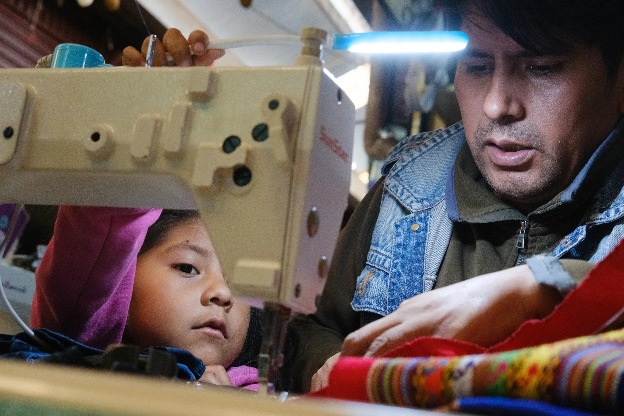 Taylor with daughter in La Cancha Market