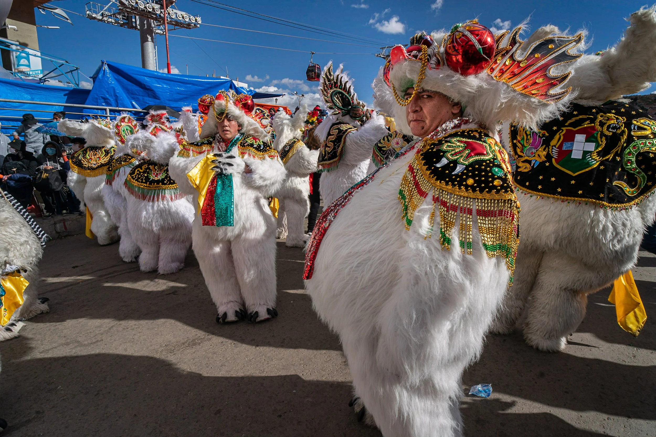 Bear masks resting in front of church after the Peregrinación
