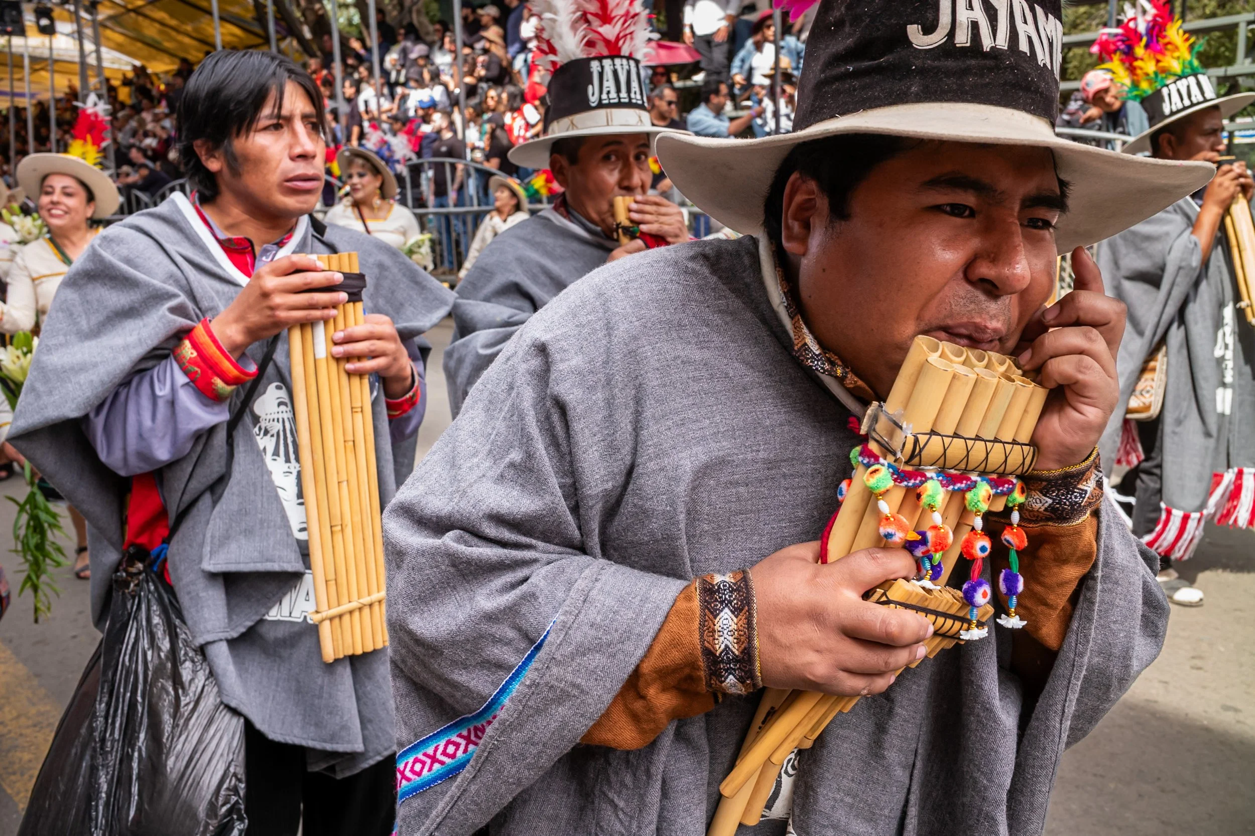 Pan flute musician playing during the Peregrinación