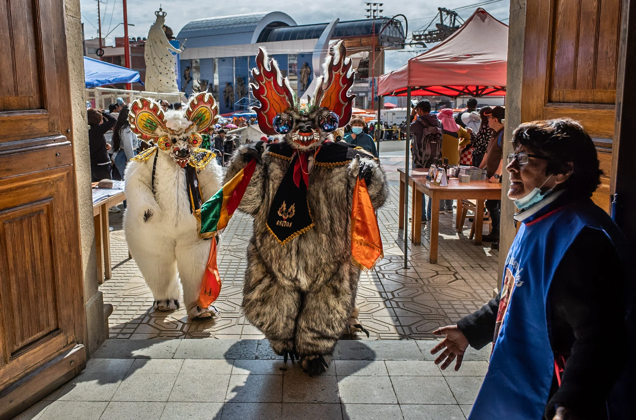 Bear mask entering church during the Peregrinación