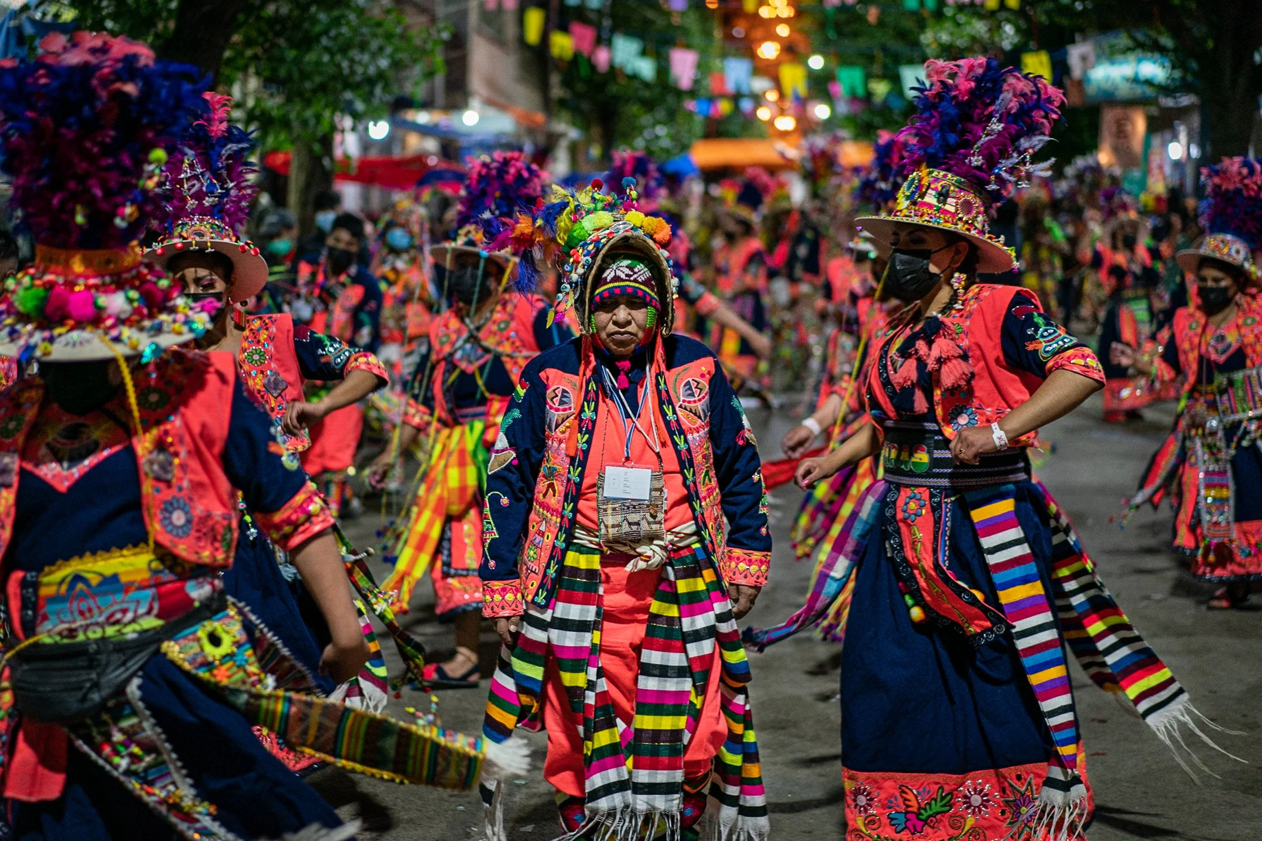 Tinku dancers moving around a still dancer