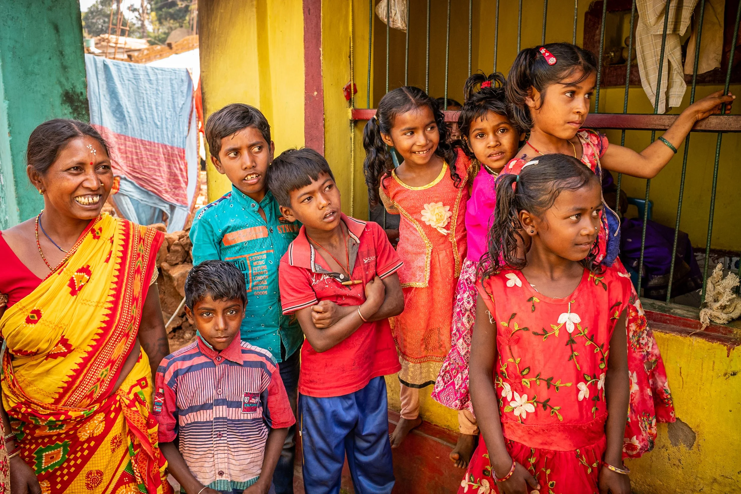Woman with group of children in Odisha village