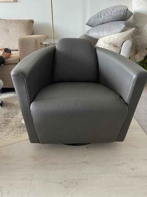 Gray Leather Bucket Swivel Chair from Bloomingdale's — GoneGirl