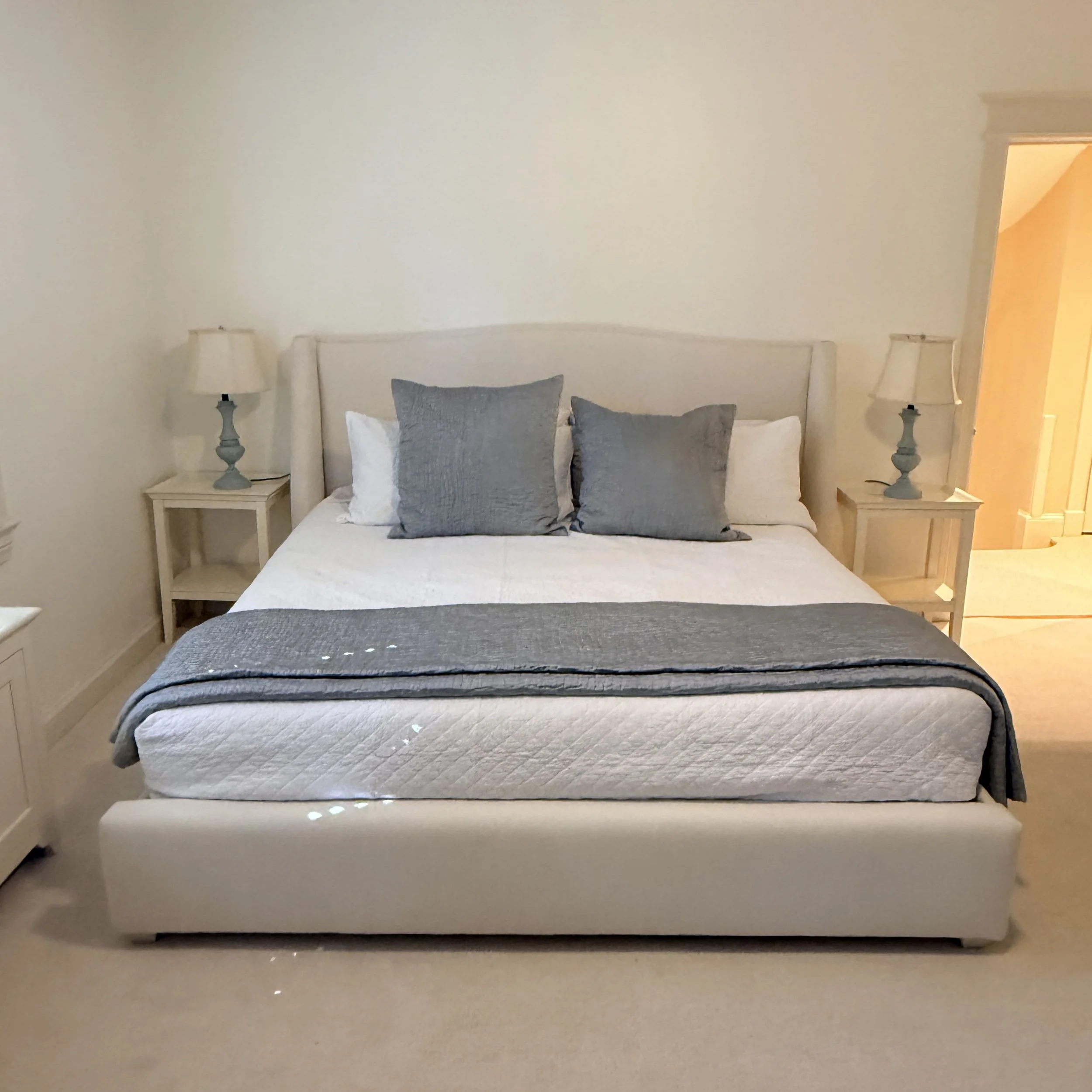 King Sized Upholstered Winged Bed