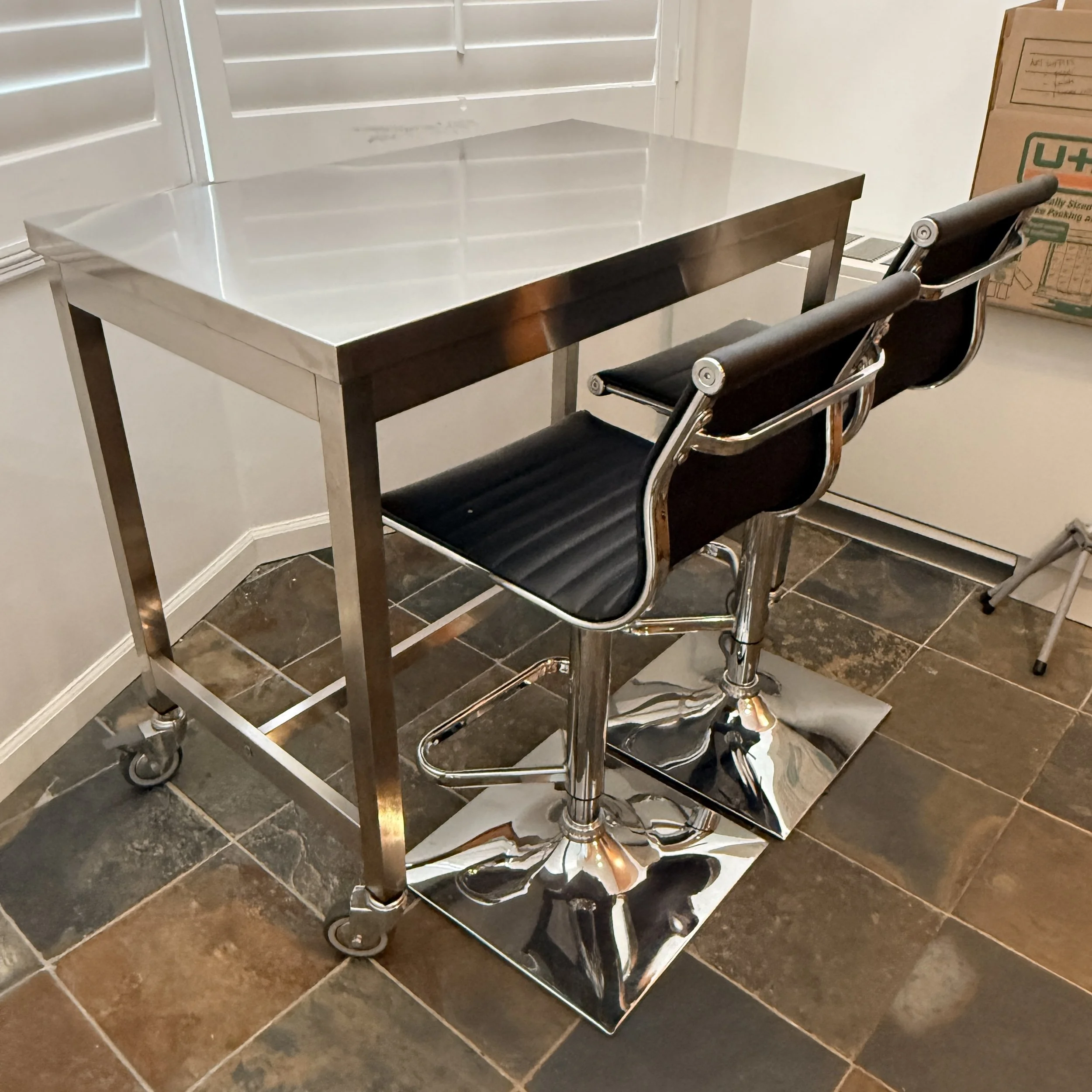 Stainless Table on Casters with Two Barstools