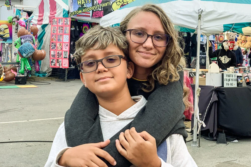 big-sister-with-arms-around-brother.jpg