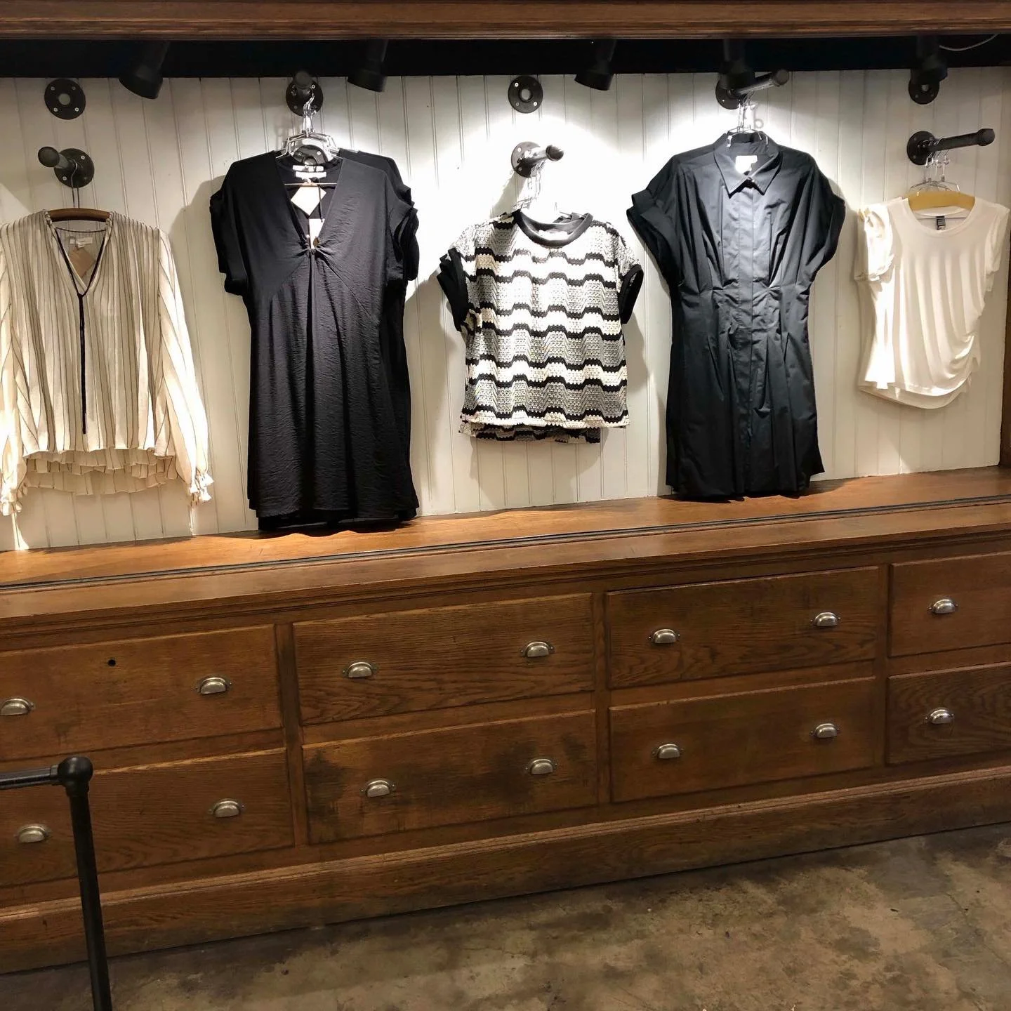 Fashions from Spain, France and the U.S. coexisting happily in our antique cabinet