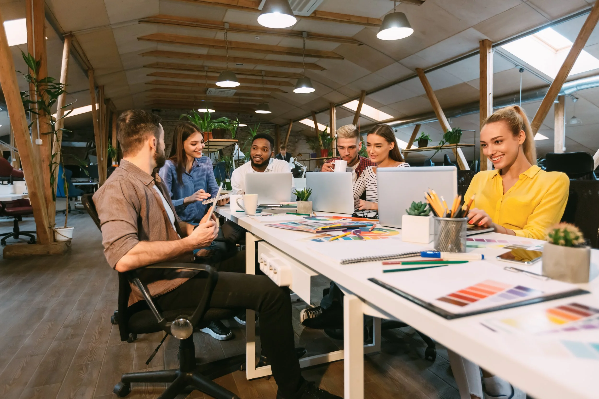 Marketing Professionals Sitting Around a Table in A Creative Brief