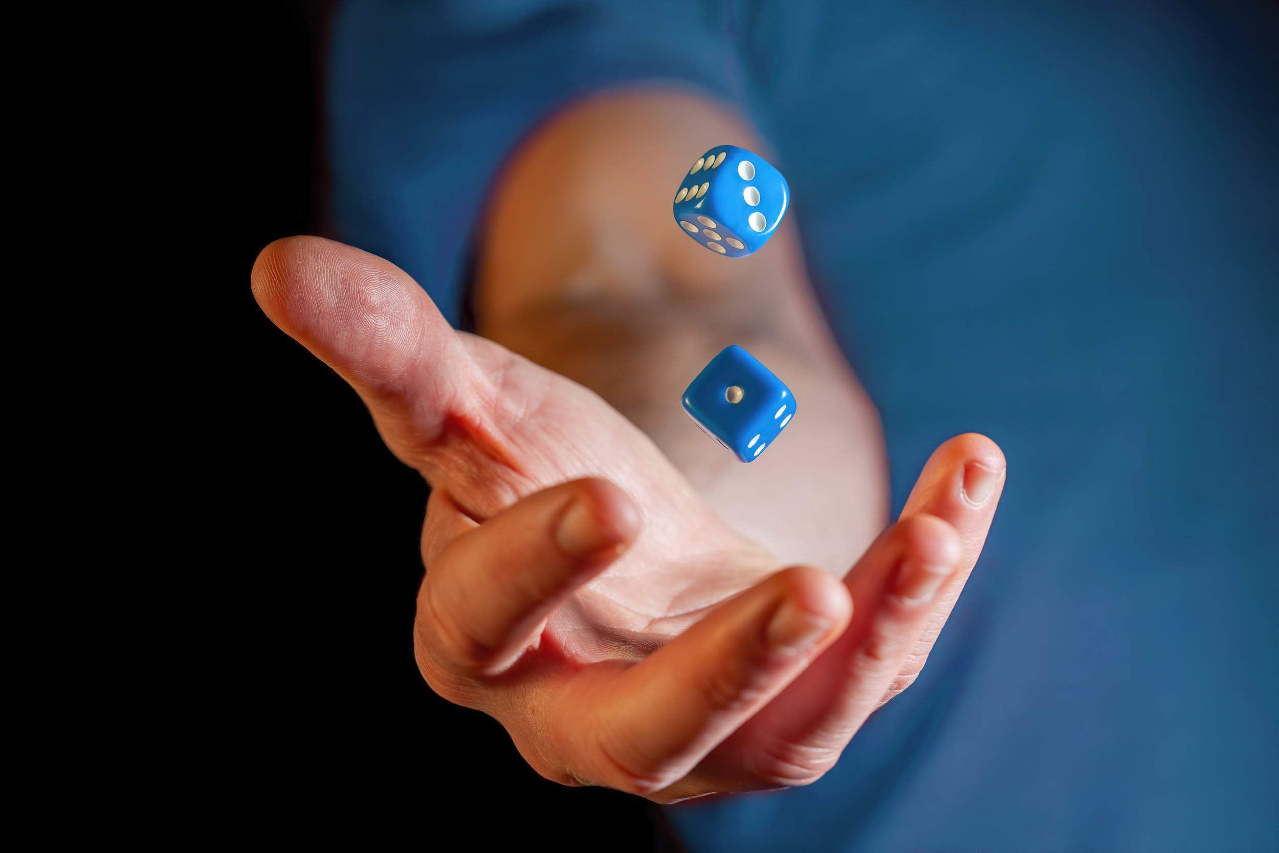 Dice being thrown in the air