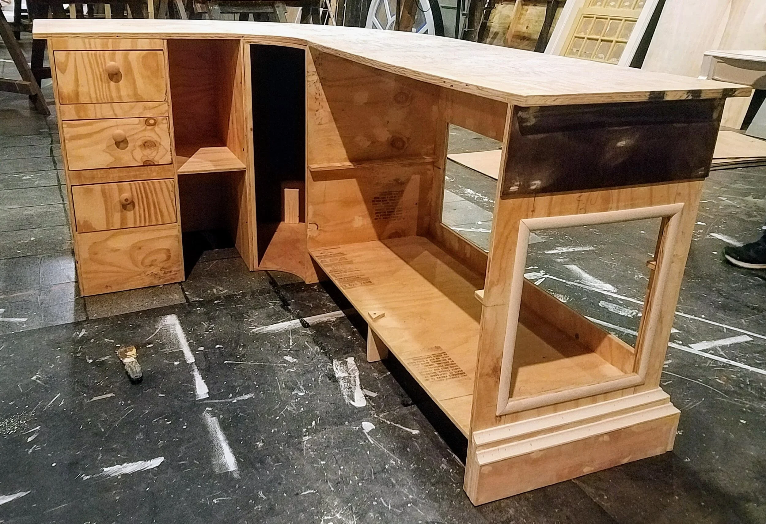 Baking Counter- 3 units were built from plywood and attached with wiggle board and masonite. The bottom trim is layers of stacked luan strips. 