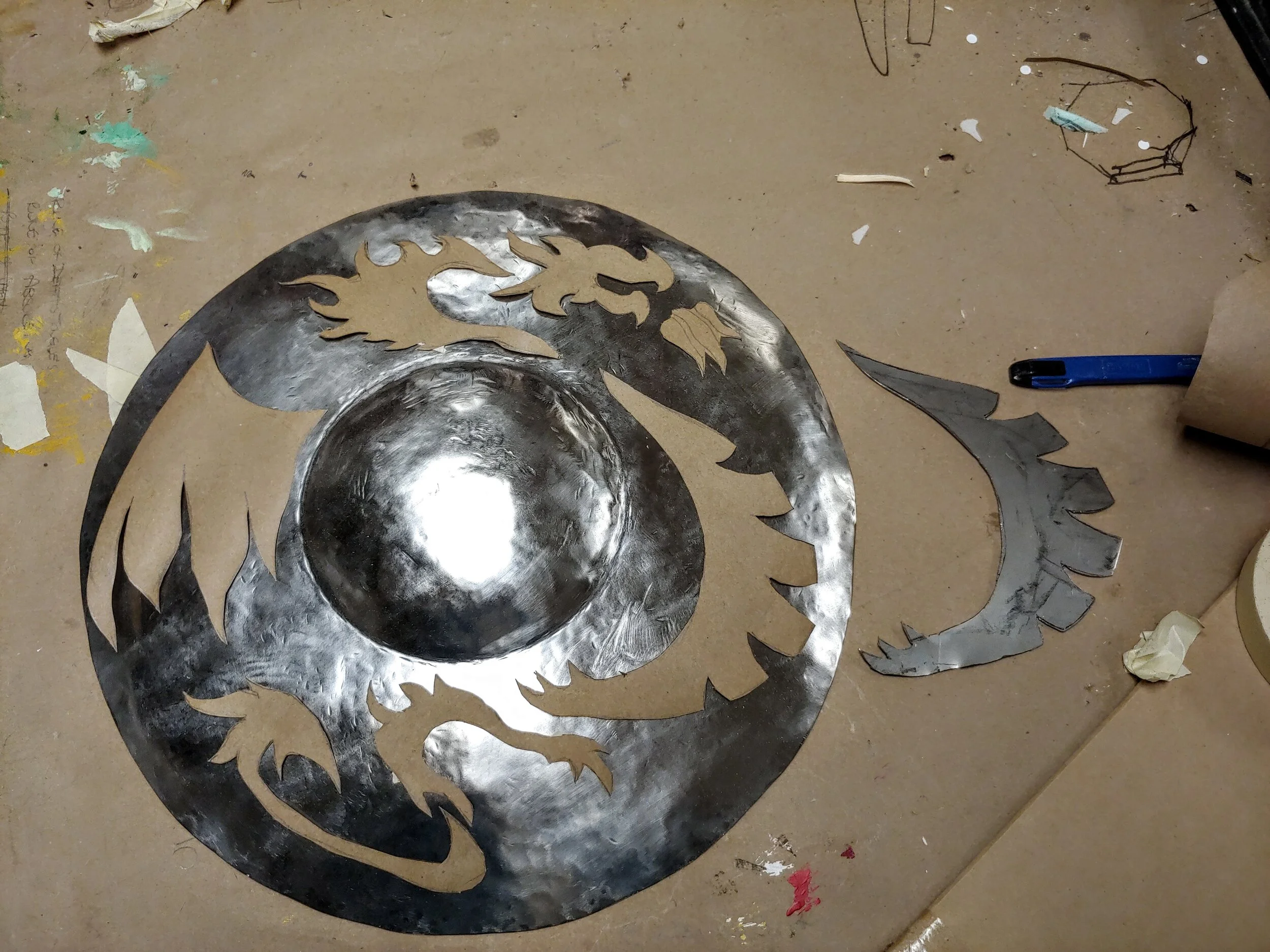 Pieces cut from scrap 1/8" steel with a metal bandsaw and filing