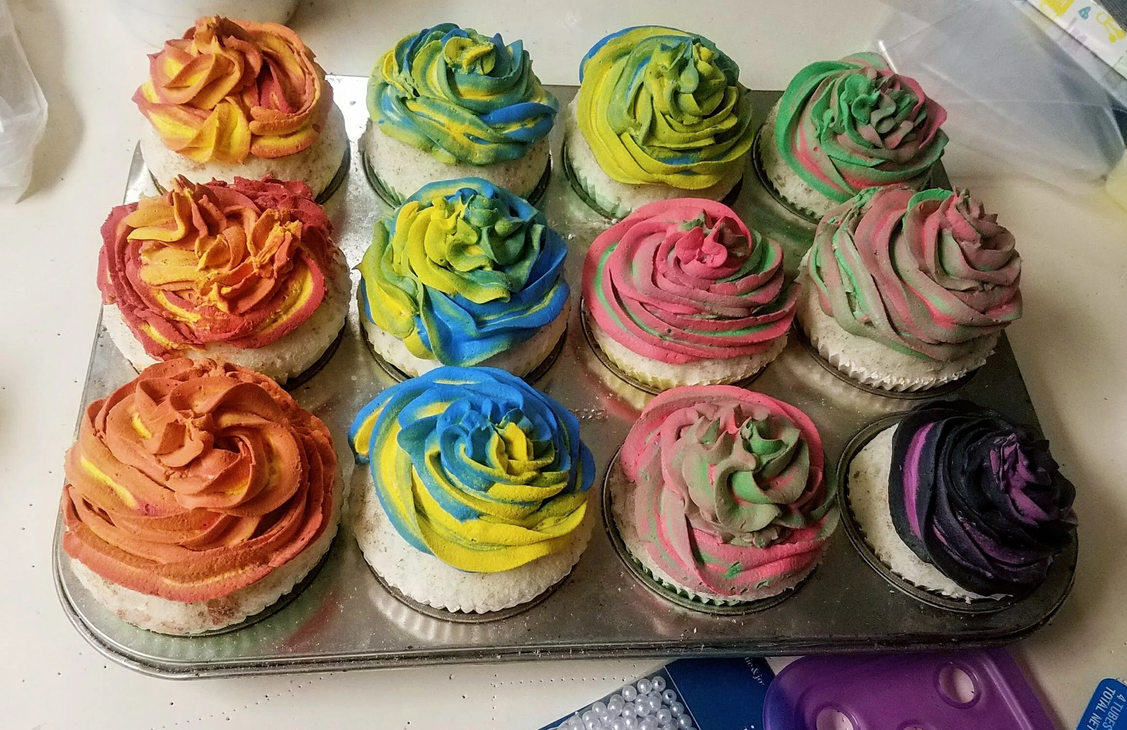 Cupcakes are shaped expanding foam with joint compound mixed with acrylic paint for icing