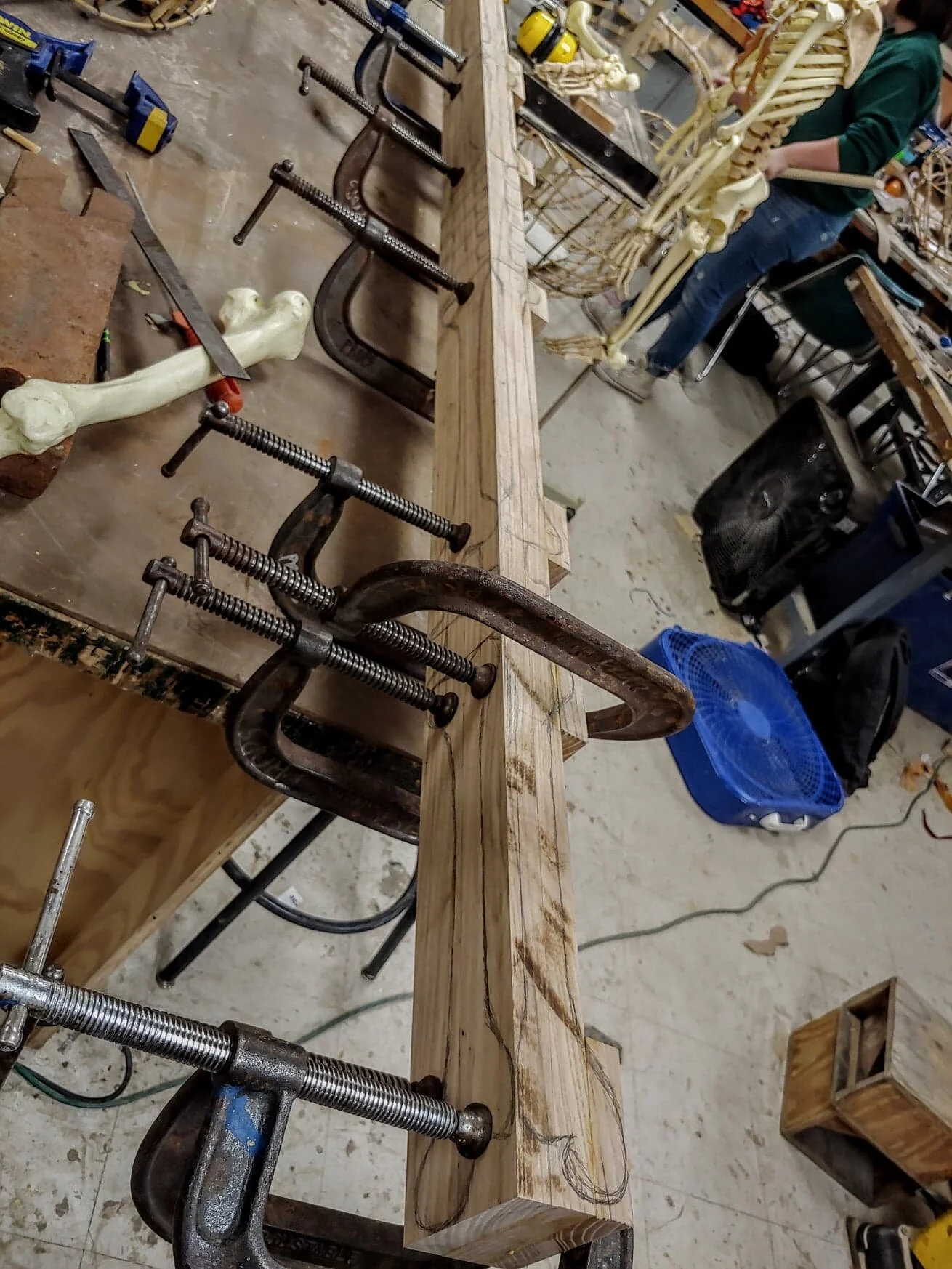 Bone staff is laid up Ash, roughly cut on the bandsaw and shaped with a 1/2” grinder. Once shaped, I went back with a Dremel and added carvings throughout the staff. It was then primed with sandal primer, stained and painted.