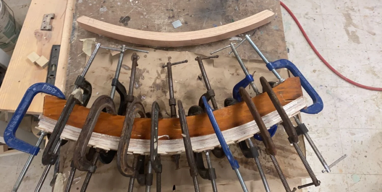 Rockers created from strips of oak and laminated together using a jig I created. Once together, I used a 1/4" grinder to shape each rocker. 