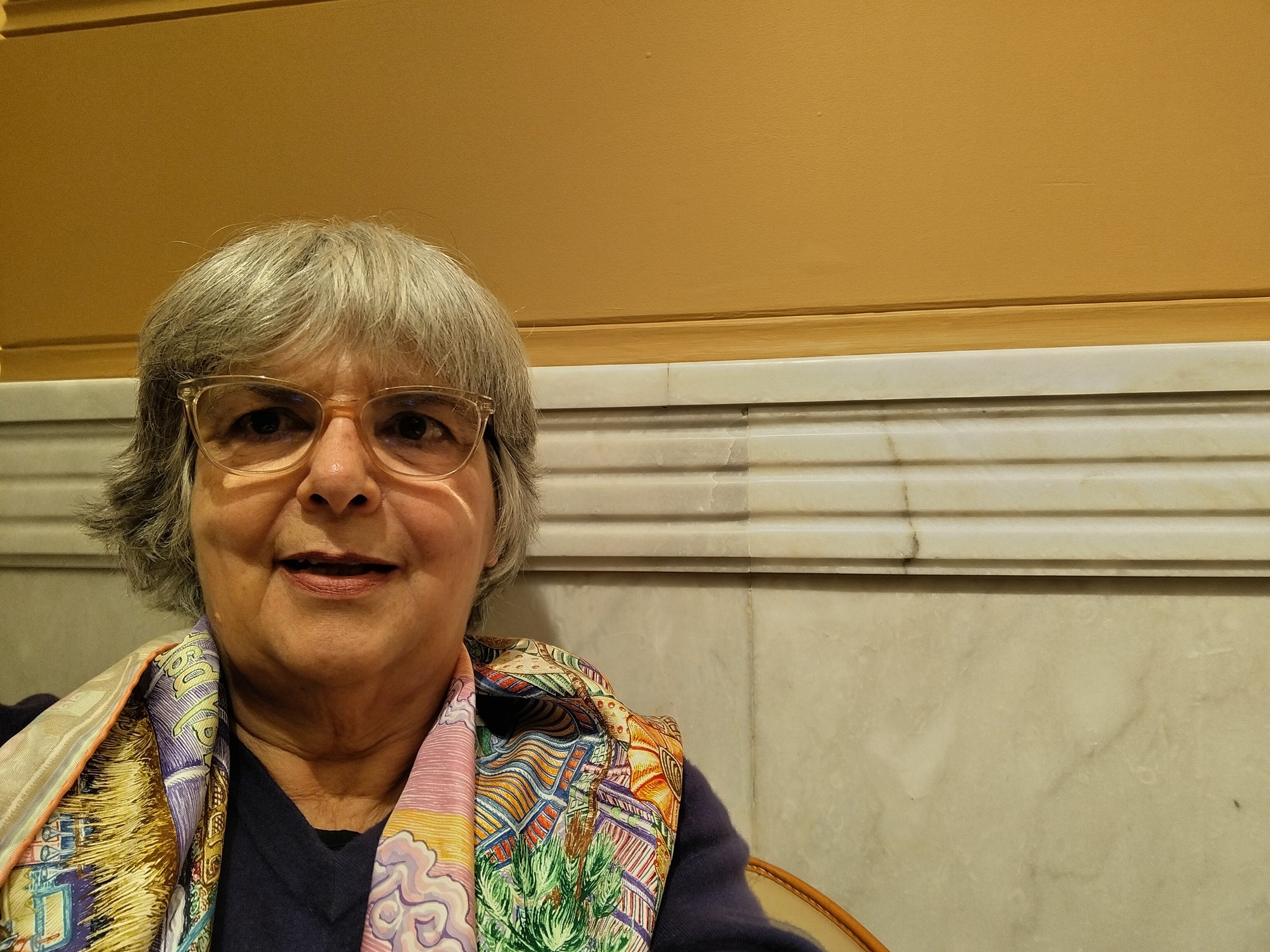 head of woman with colourful scarf on shoulders