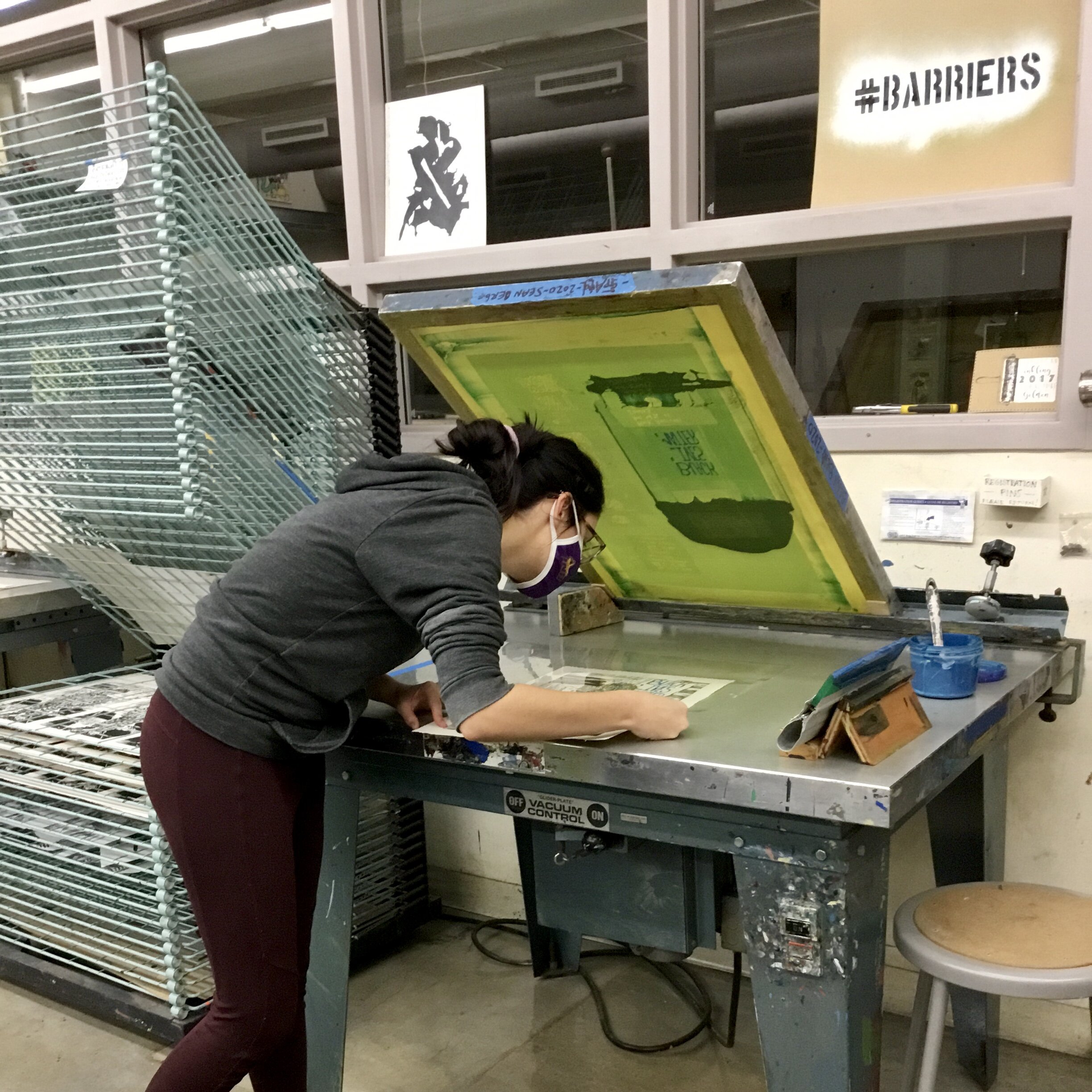 Alissa prepping an area for screen printing