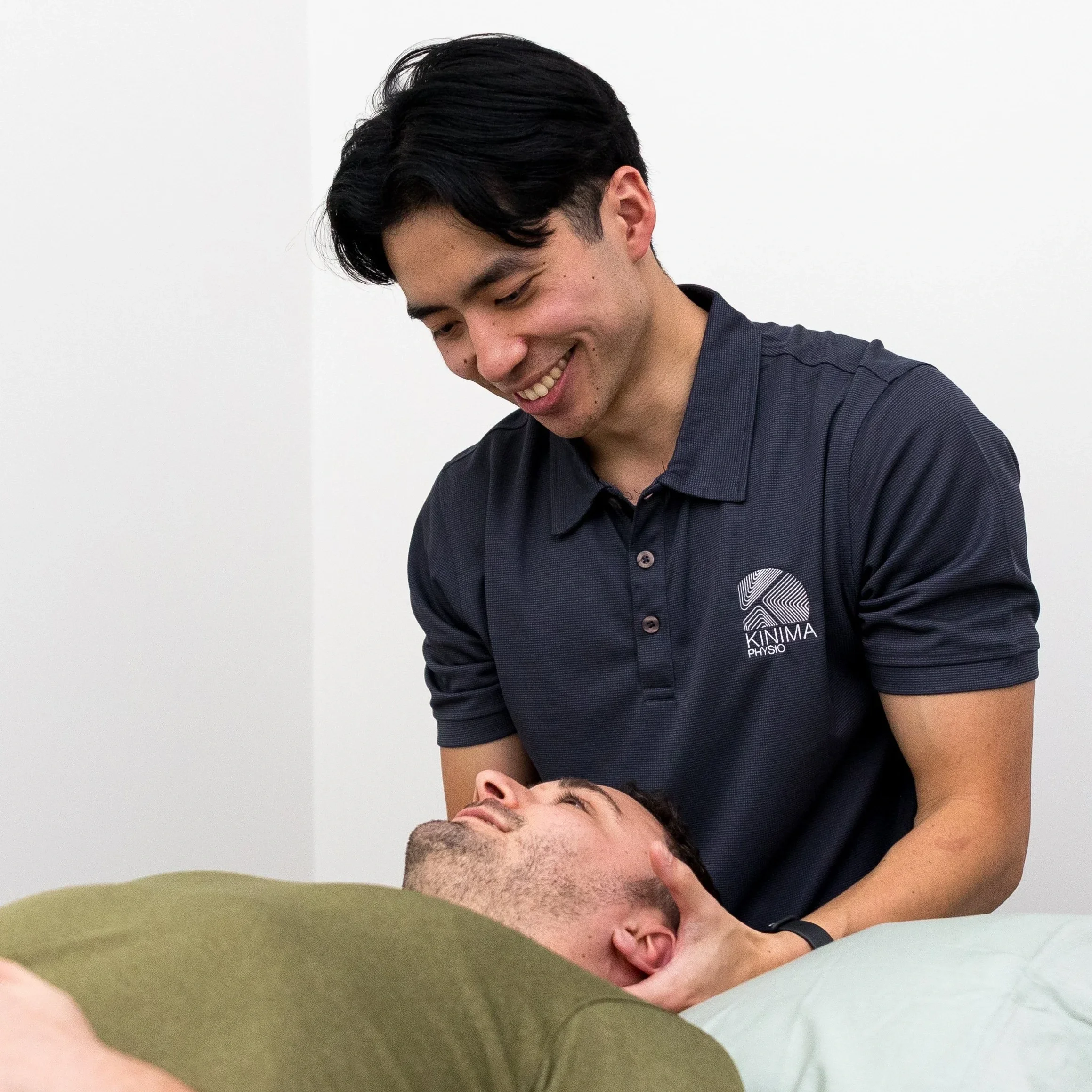 Physiotherapist providing one on one manual therapy treatment during a personalised physiotherapy consultation.