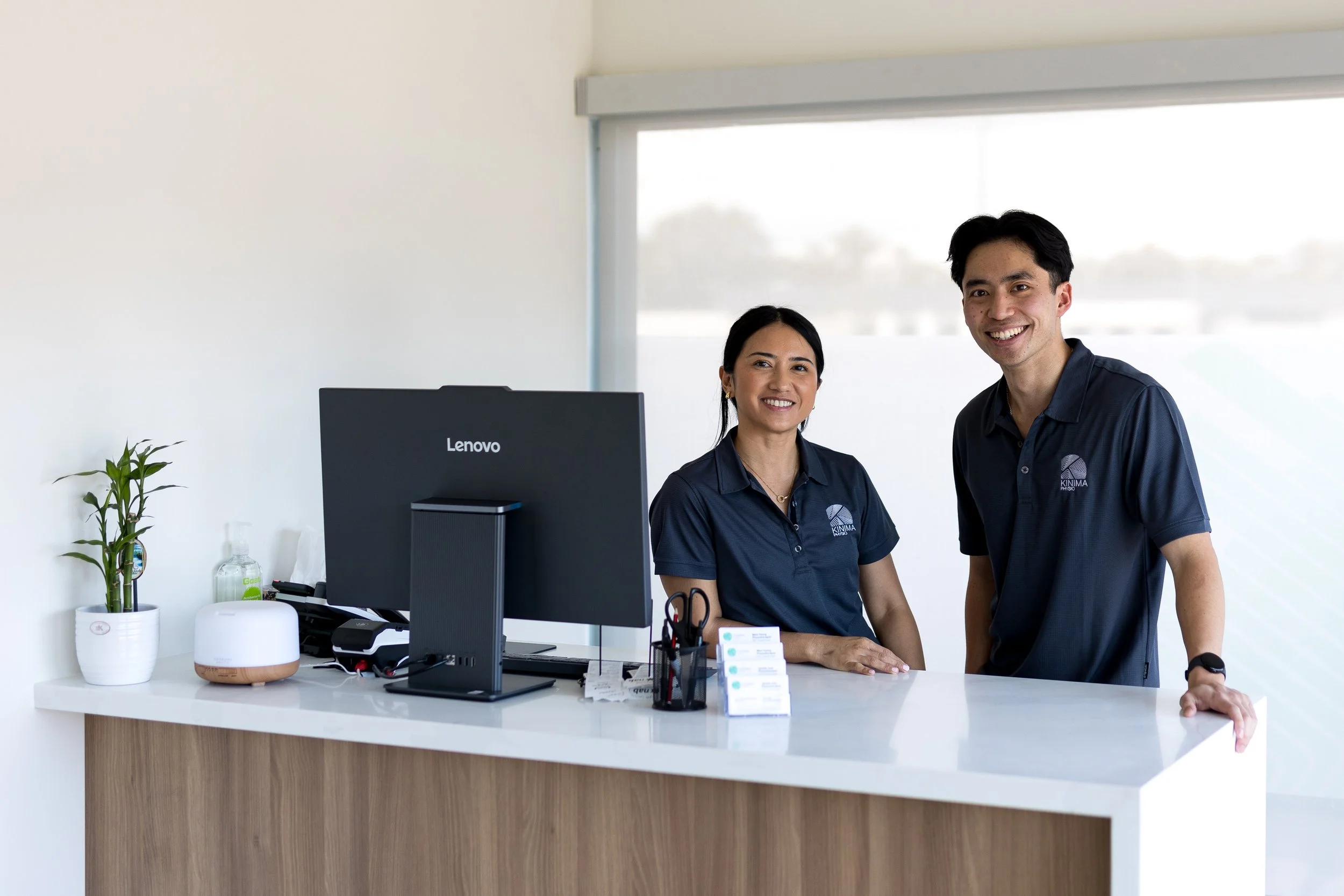 Friendly Kinima Physio team welcoming clients to the West Leederville clinic reception.