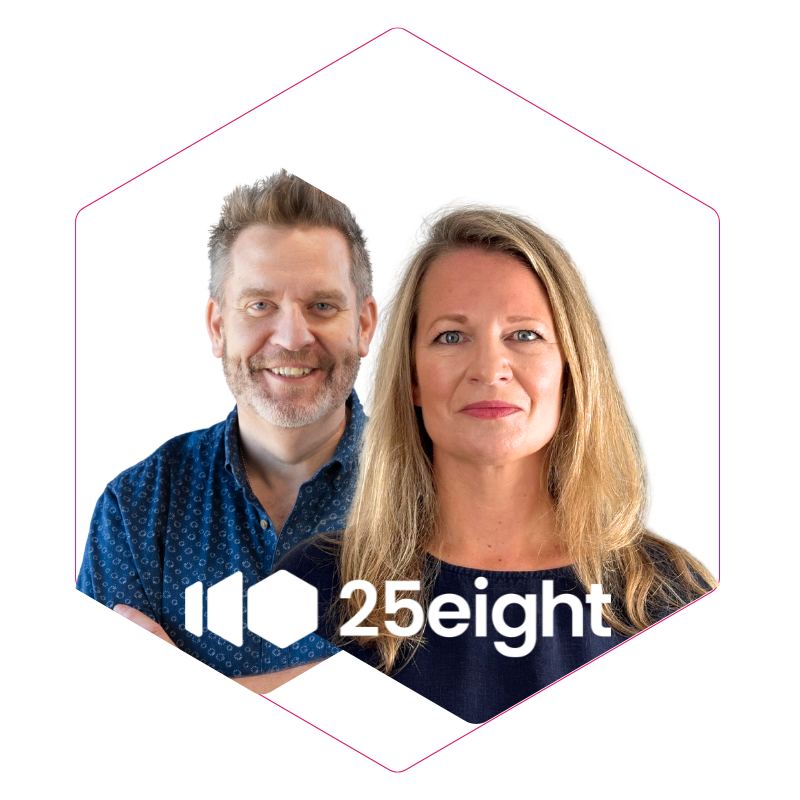 A man and woman posing together against a white background, with pink geometric outline and text that says "25eight".
