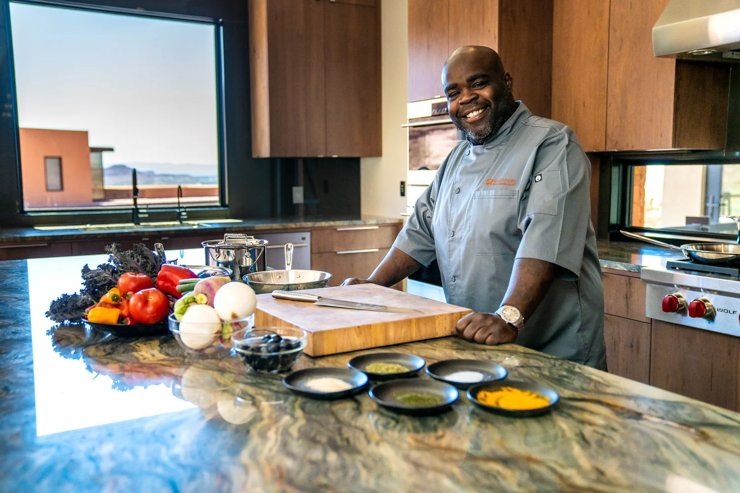 A chef focused on their craft in a working kitchen.