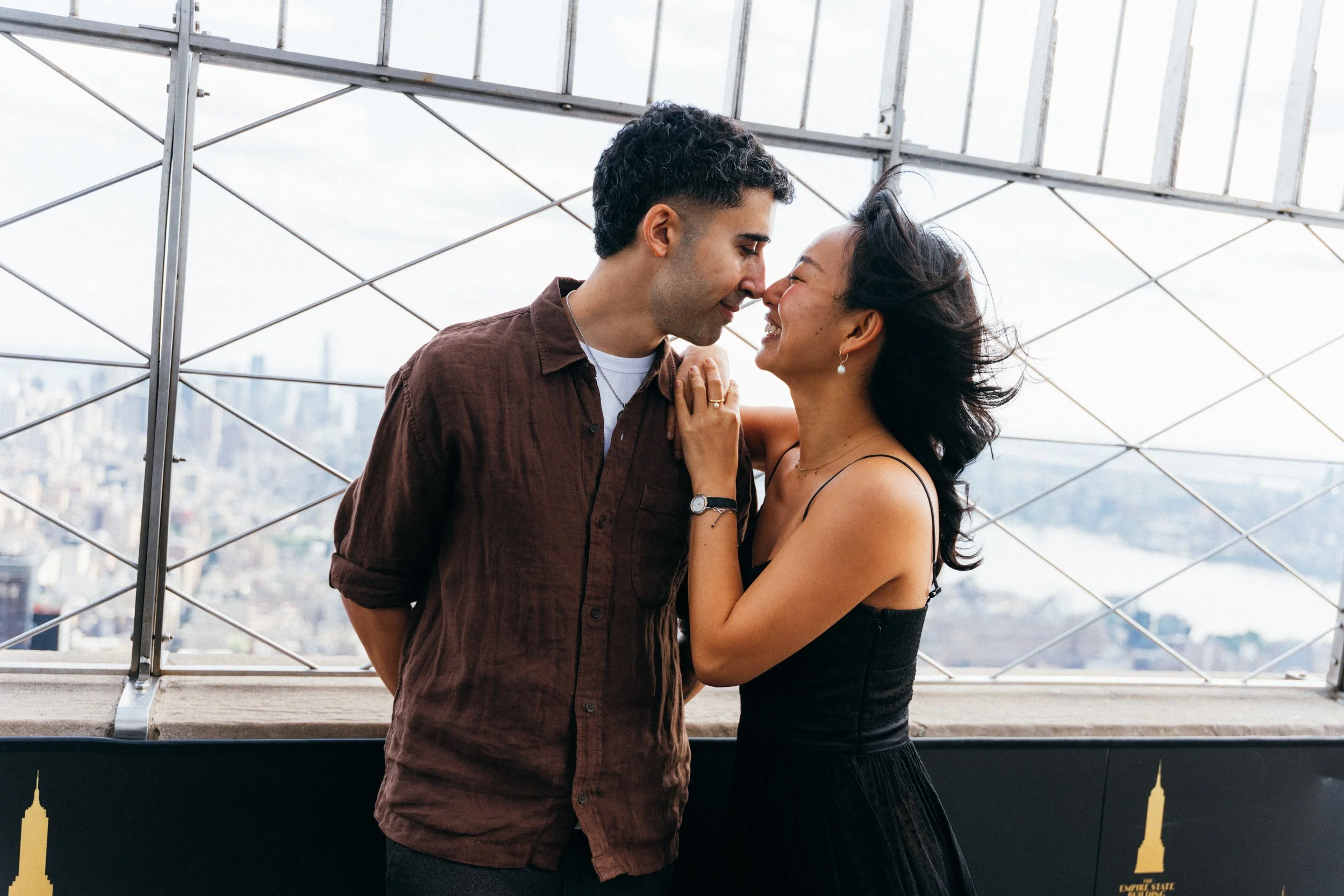 Couple embracing on a New York City observation deck