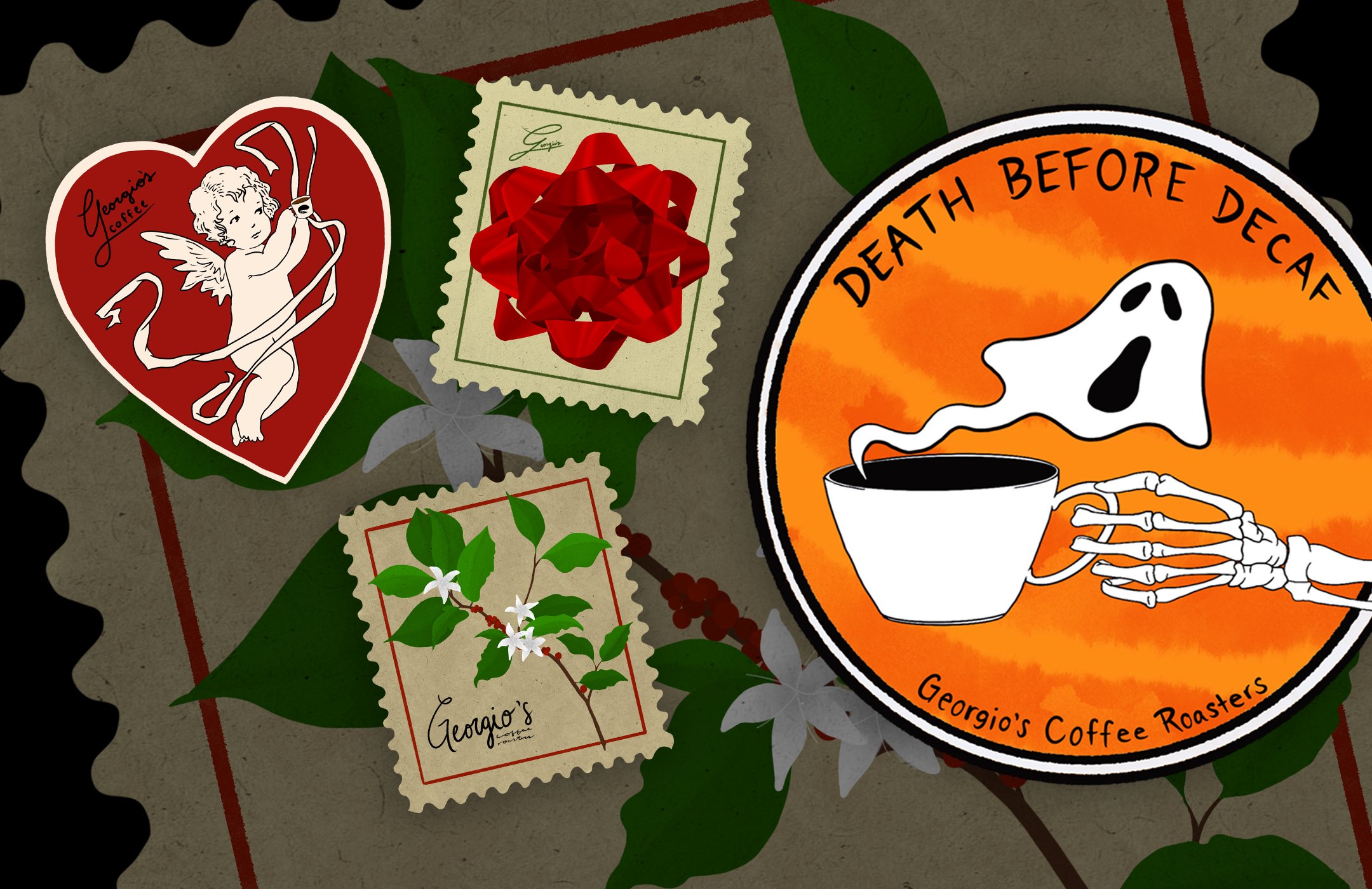 A collection of stickers and stamps on a table, including a red heart with a cupid and arrow, a stamp with a red bow, a stamp with green leaves and white flowers labeled "Georgia's Coffee," and a circular logo with a ghost holding a coffee cup reading "Death Before Decaf" and "Georgia's Coffee Roasters."