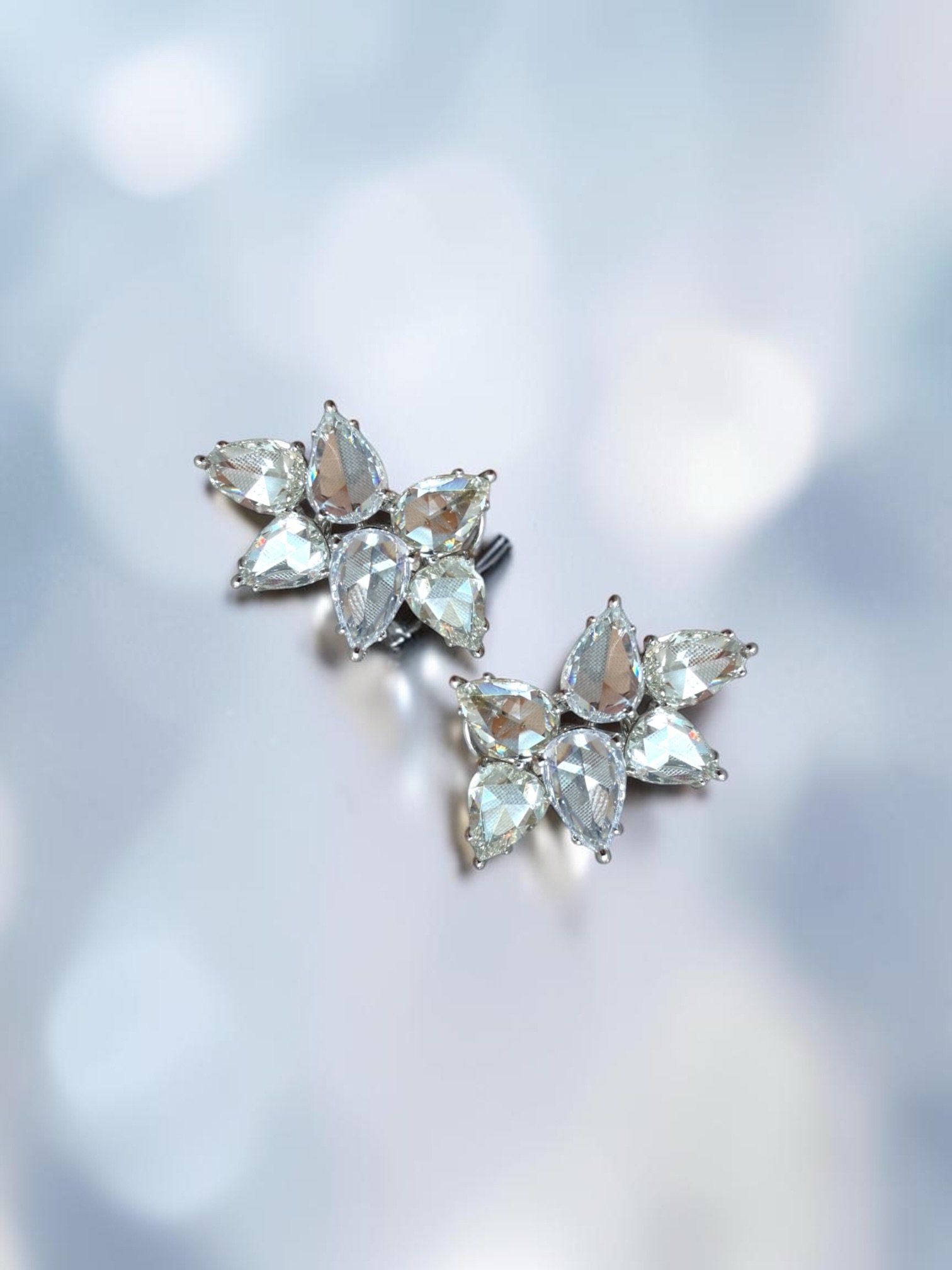 10cts rose cut pear shape diamond statement clusters&hellip;now THAT is a statement!

The beauty of having rose cuts diamonds is a greater proportion of the stone is spread across its face rather than hidden in a deep pavilion. So, for example, a 1 c