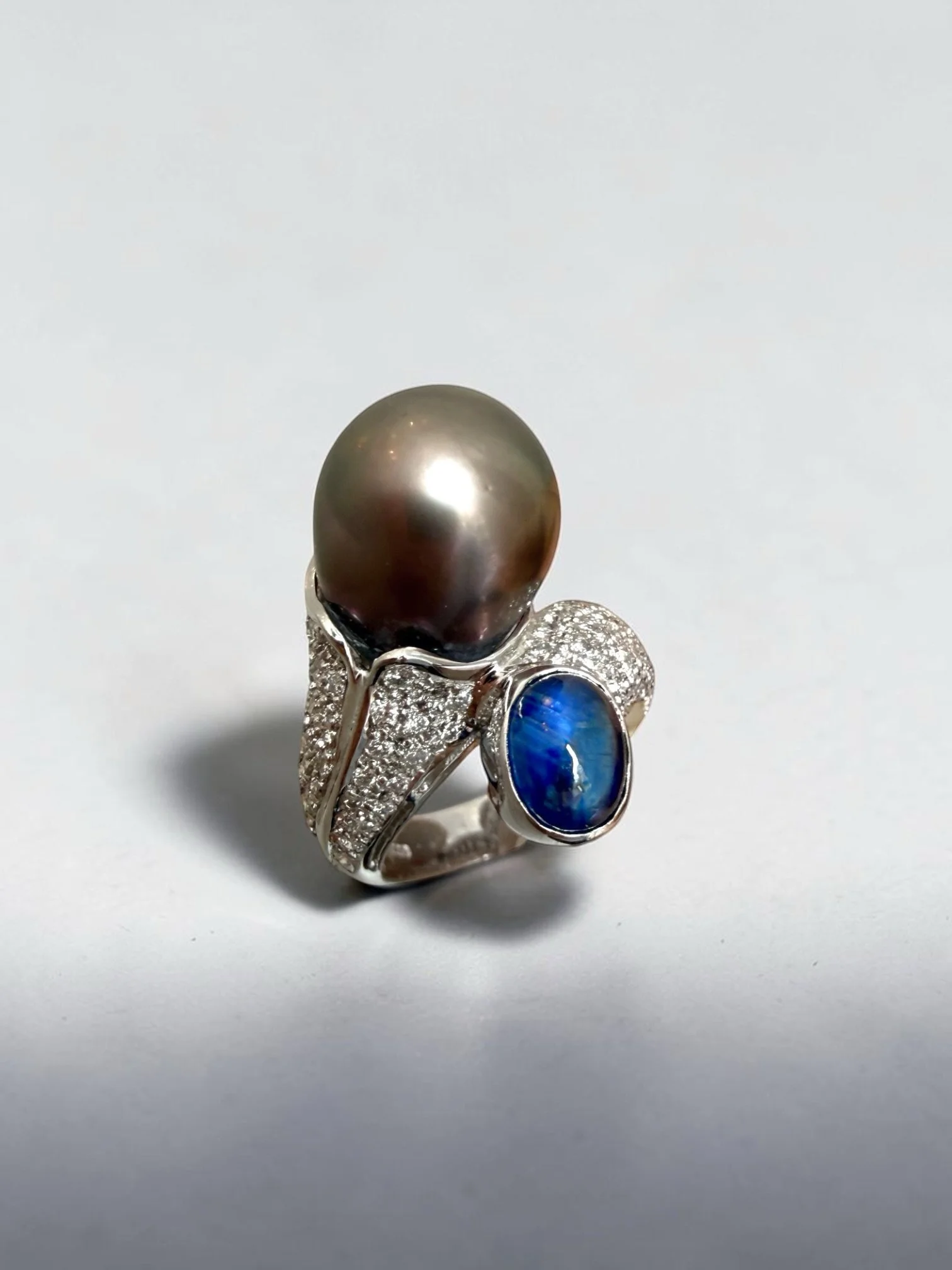 Inspired by ammonites - creatures of the another world 

Love this set of ring and earrings using Tahitian pealed, sapphire cabochons and diamonds