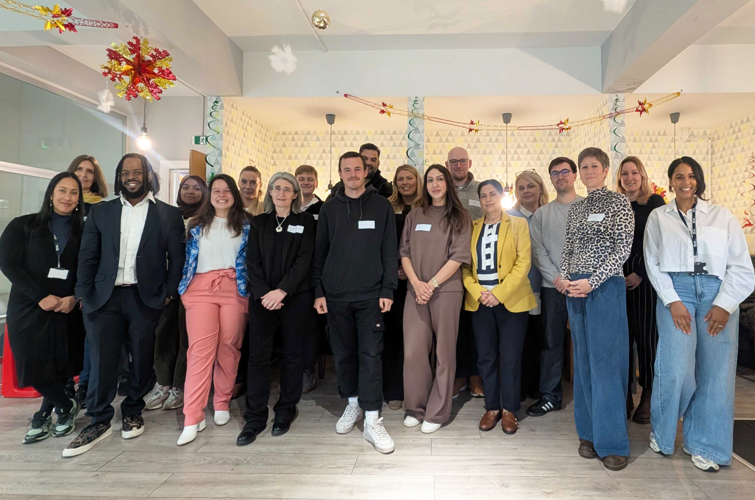 A group of people standing at LDN office HQ