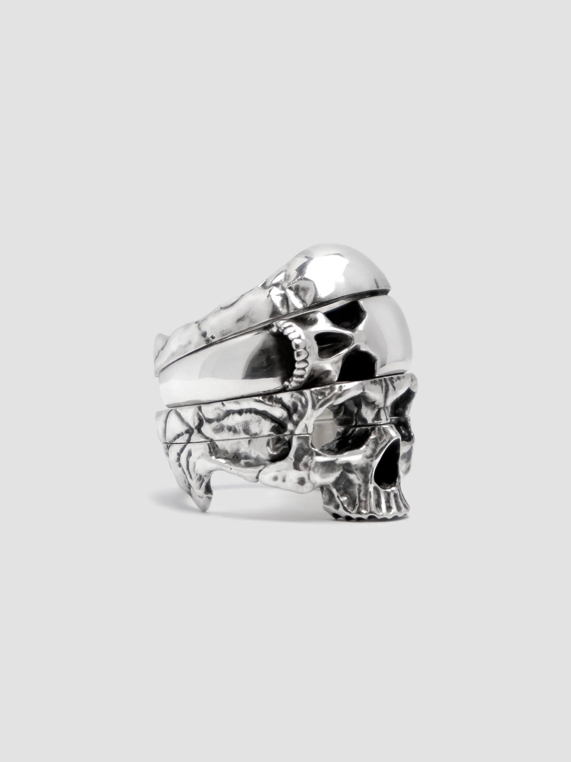 Asymmetrical stack featuring Slice of Skull.
Sterling silver/classic finish. 