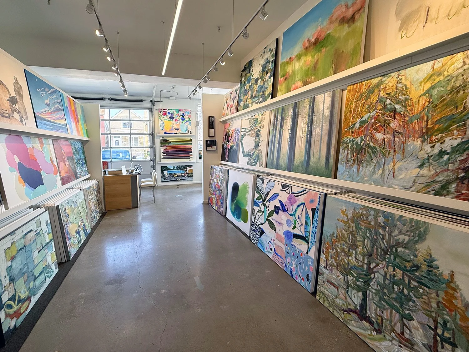 Image of the interior of Canvas Gallery in Toronto, featuring an assortment of original, Canadian artwork.