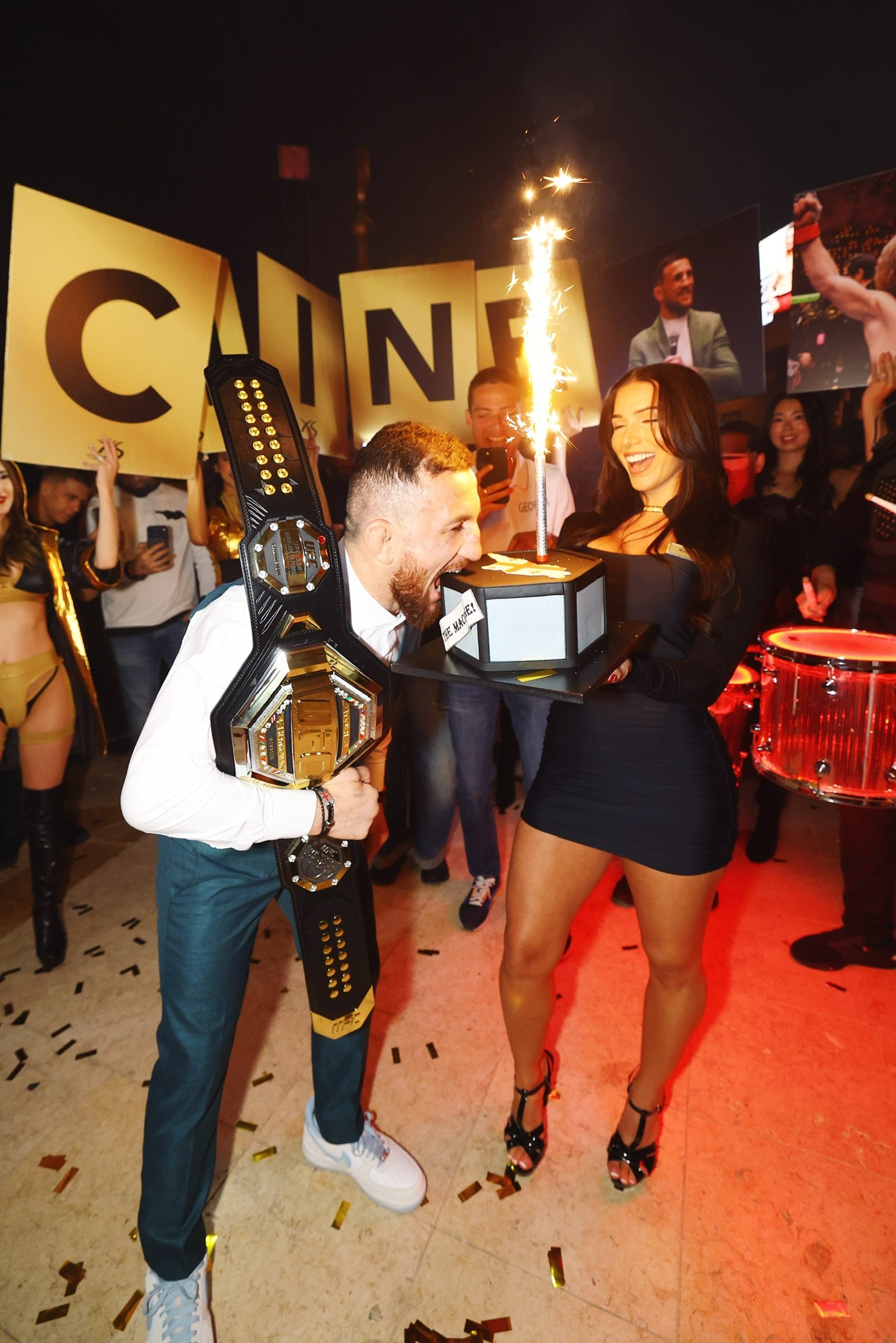 Merab Dvalishvili biting his winning cake at XS Las Vegas