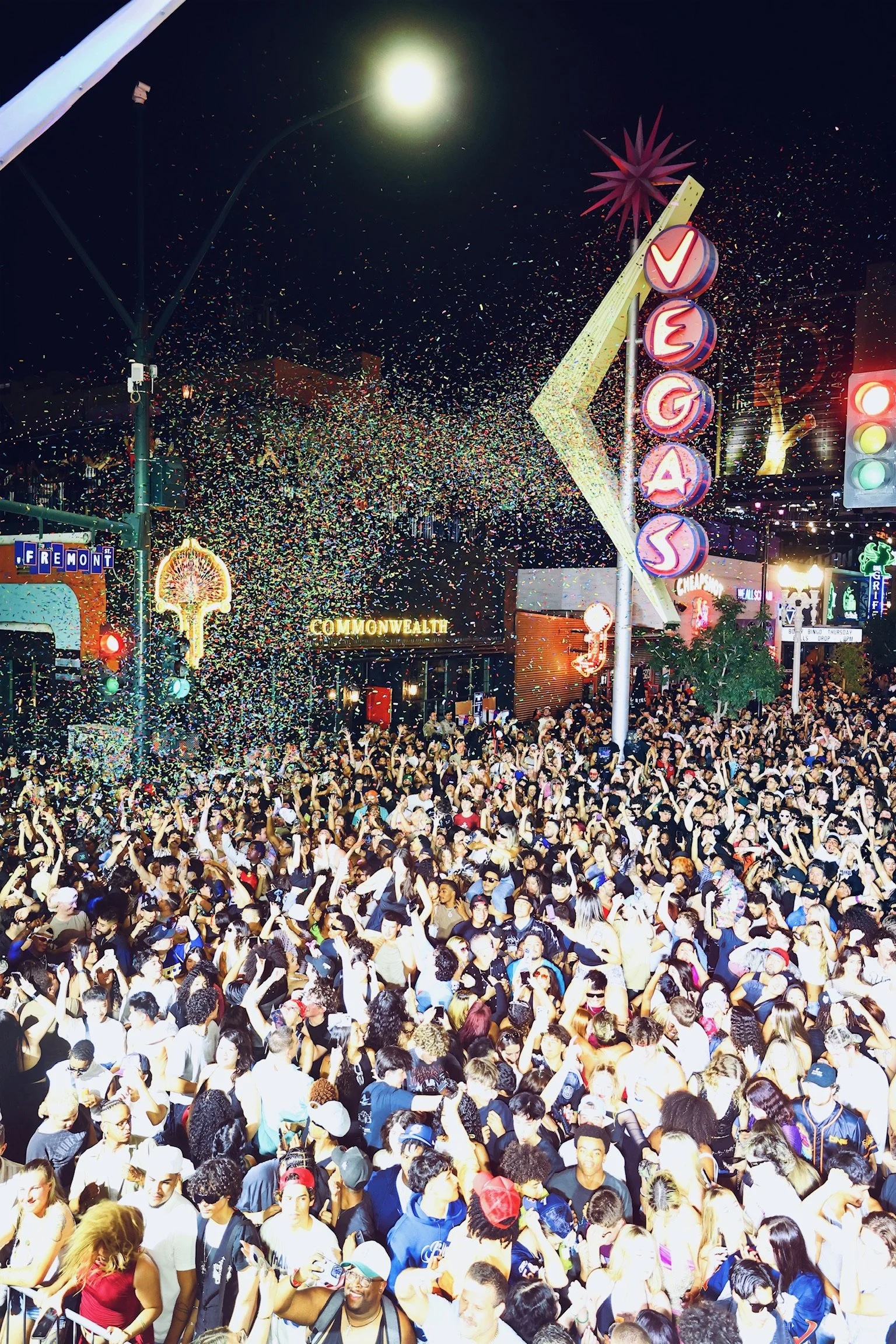 Aerial view of thousands of fans with arms raised during the Major Lazer takeover at Commonwealth, illustrating the scale of Las Vegas block parties.
