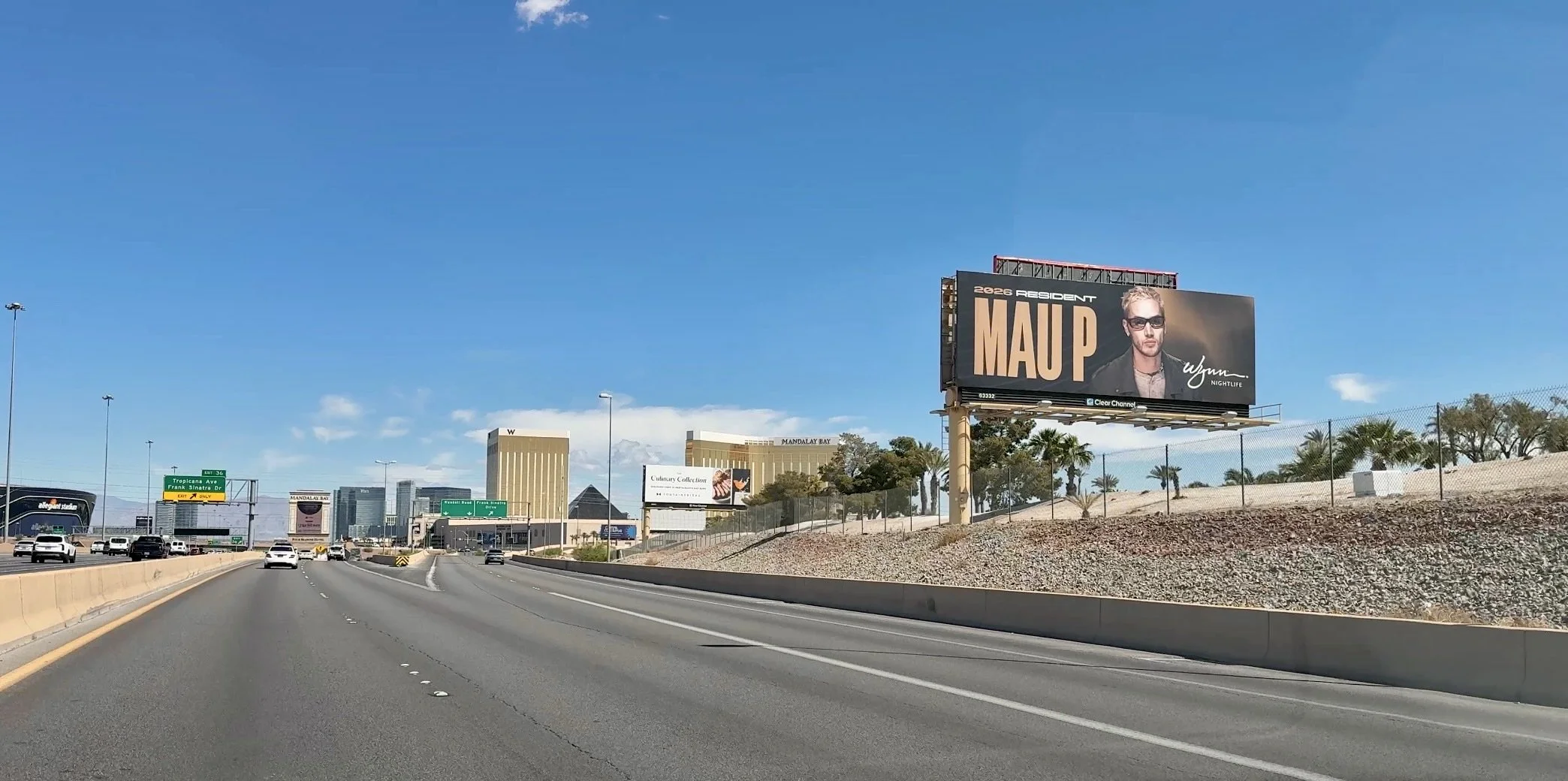 A bold, typography-heavy billboard for Mau P, signaling a shift toward the "New Wave" of Vegas house music. The design utilizes deep shadows and a gritty, cinematic portrait to contrast with the surrounding neon.
