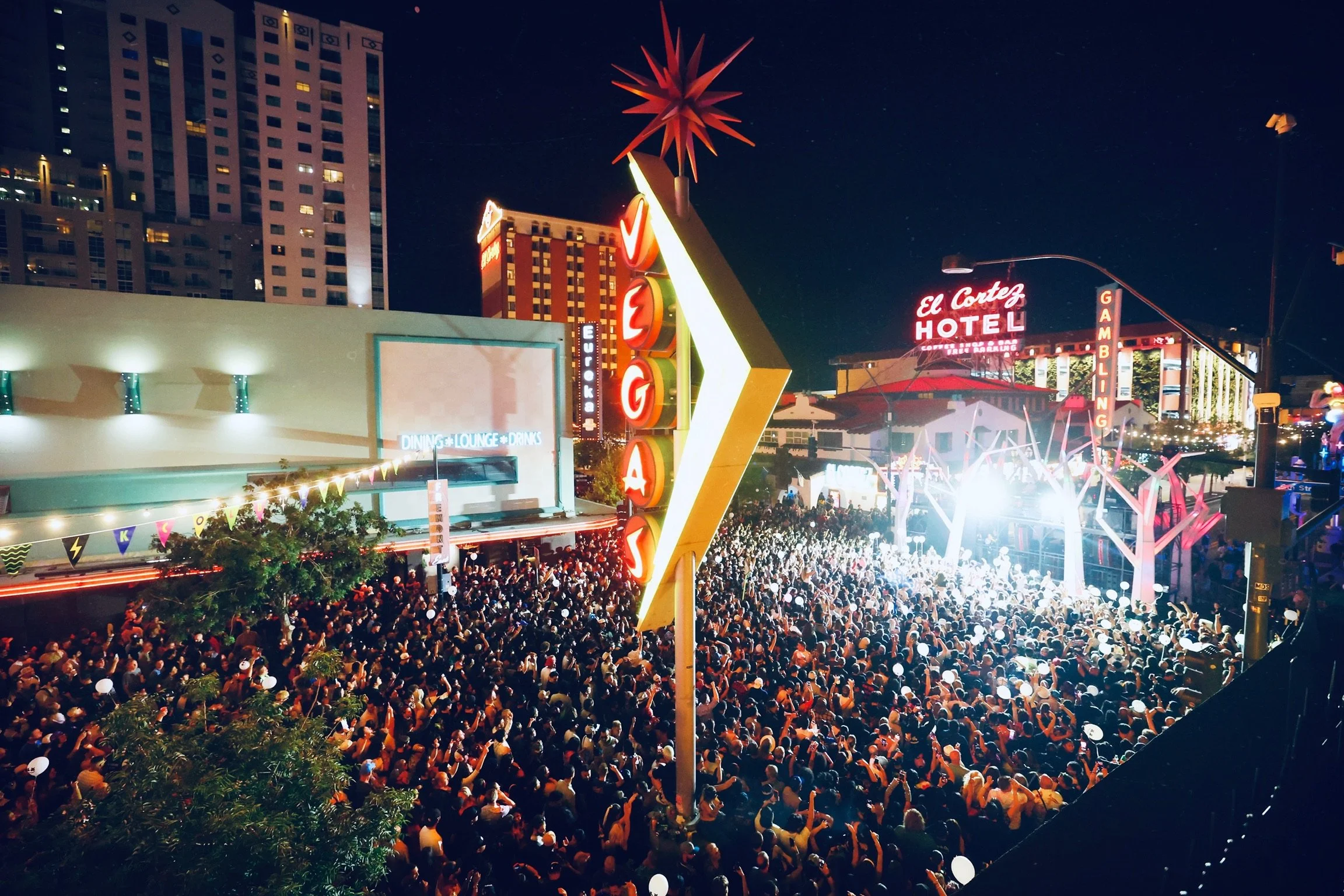 Wide-angle shot of the Feed The Block main stage in Downtown Las Vegas, showcasing professional stage lighting, massive LED screens, and high-production value for local music festivals. @dmahoneyphoto