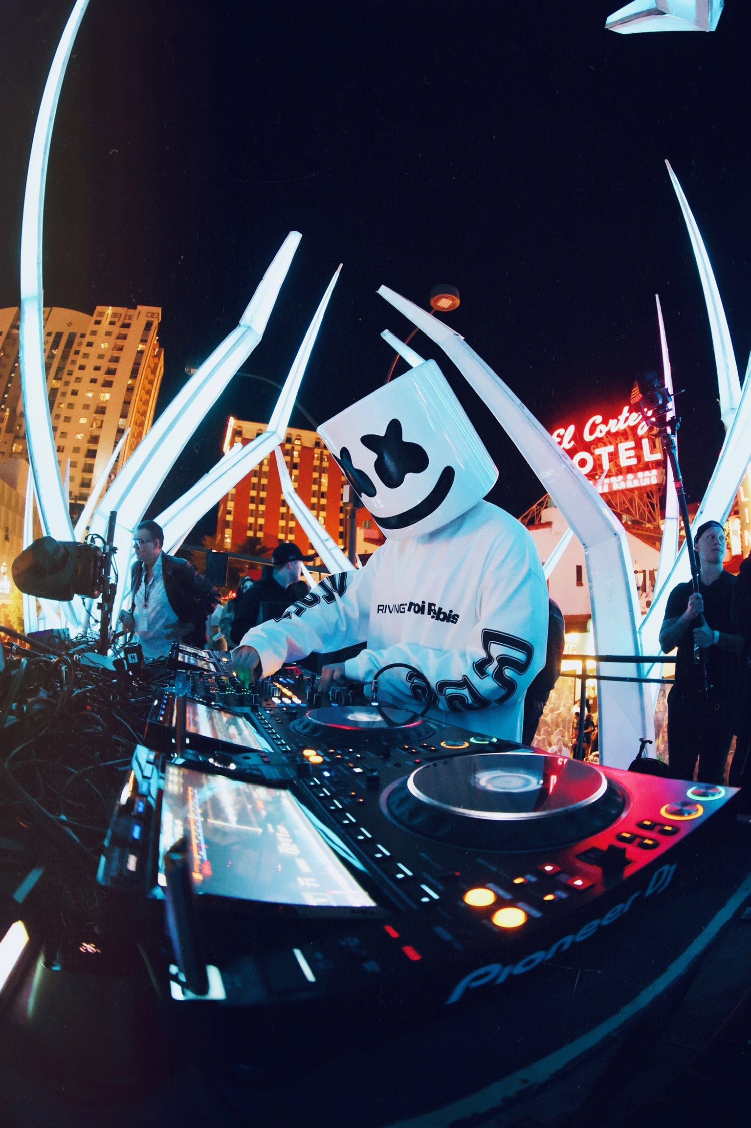 DJ Marshmello performing live for Feed The Block DTLV, featuring the signature Marshmello helmet and white crowd balloons in an immersive Downtown Las Vegas nightlife setting. @dmahoneyphoto