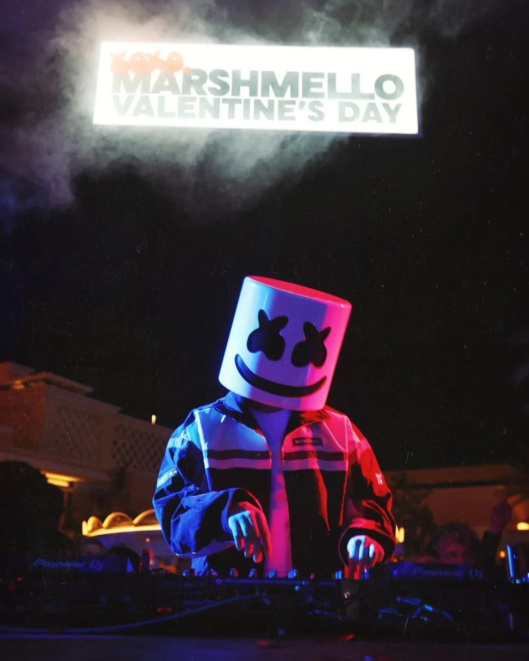 Marshmello with Valentine's Day sign above Djing.