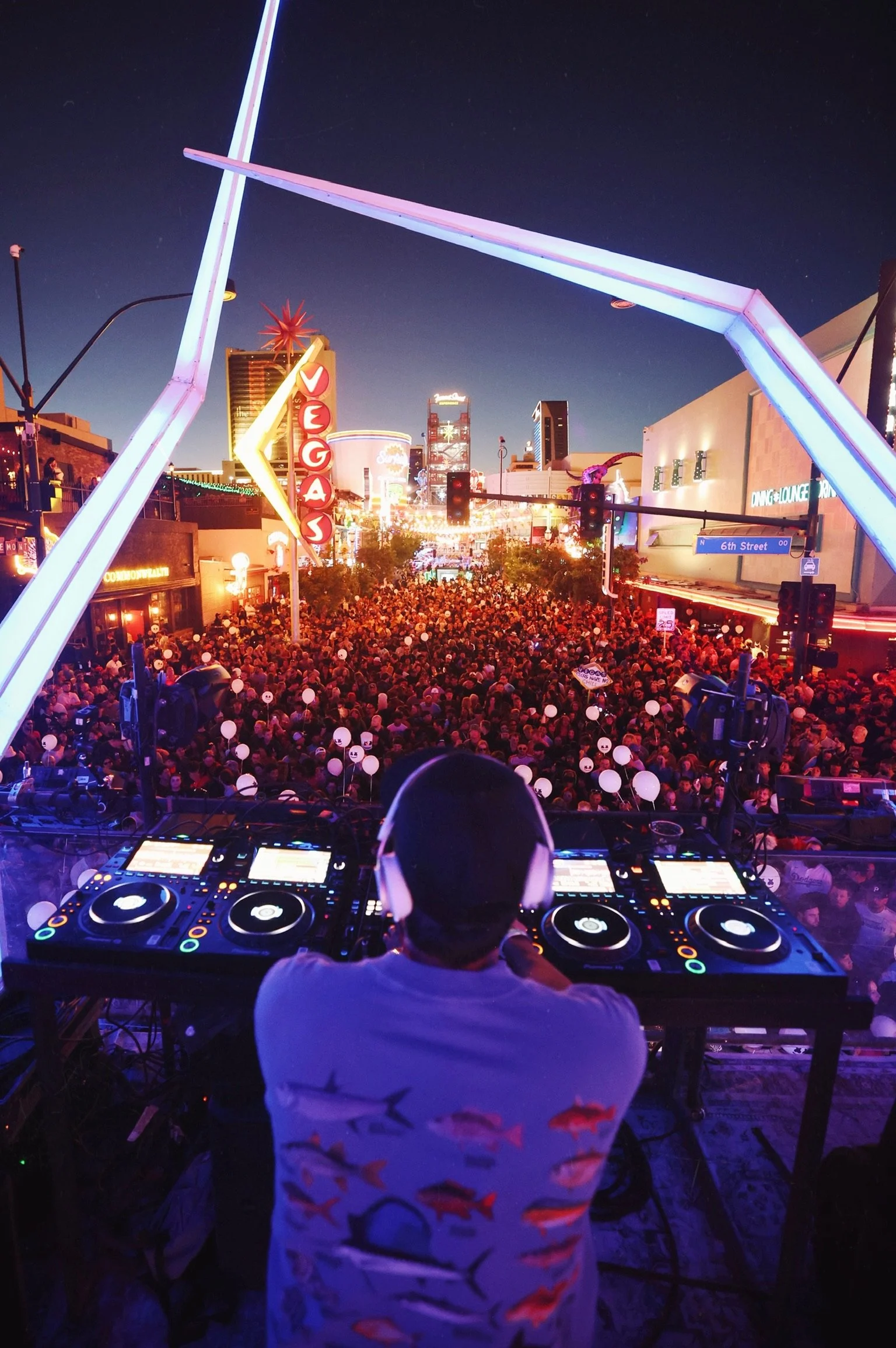 Overhead view of a diverse crowd at a Downtown Las Vegas block party, illustrating the community-driven atmosphere and cultural shift in the DTLV entertainment scene. @dmahoneyphoto