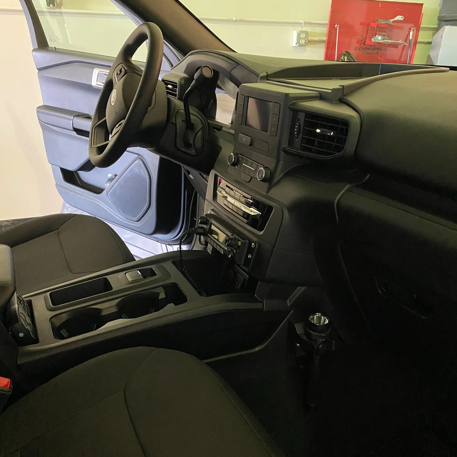 Ford fleet vehicle interior prepared for radio and equipment integration