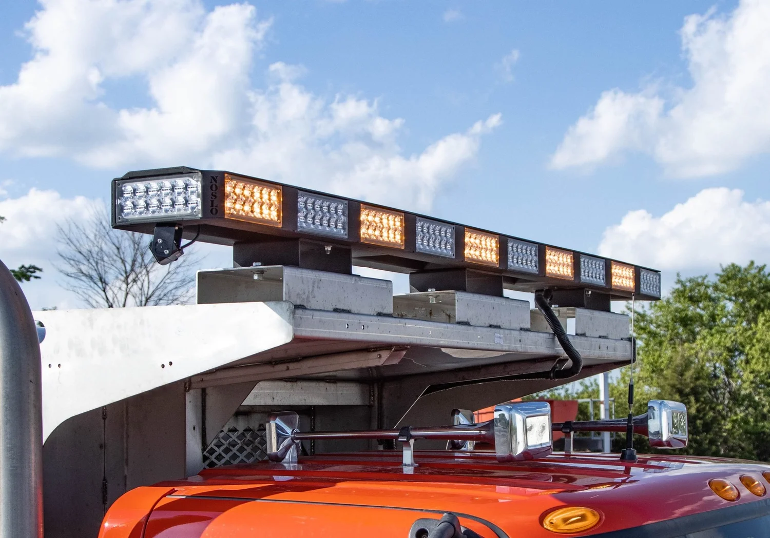Custom amber and white warning lightbar installed on a public works truck by Multiplicity